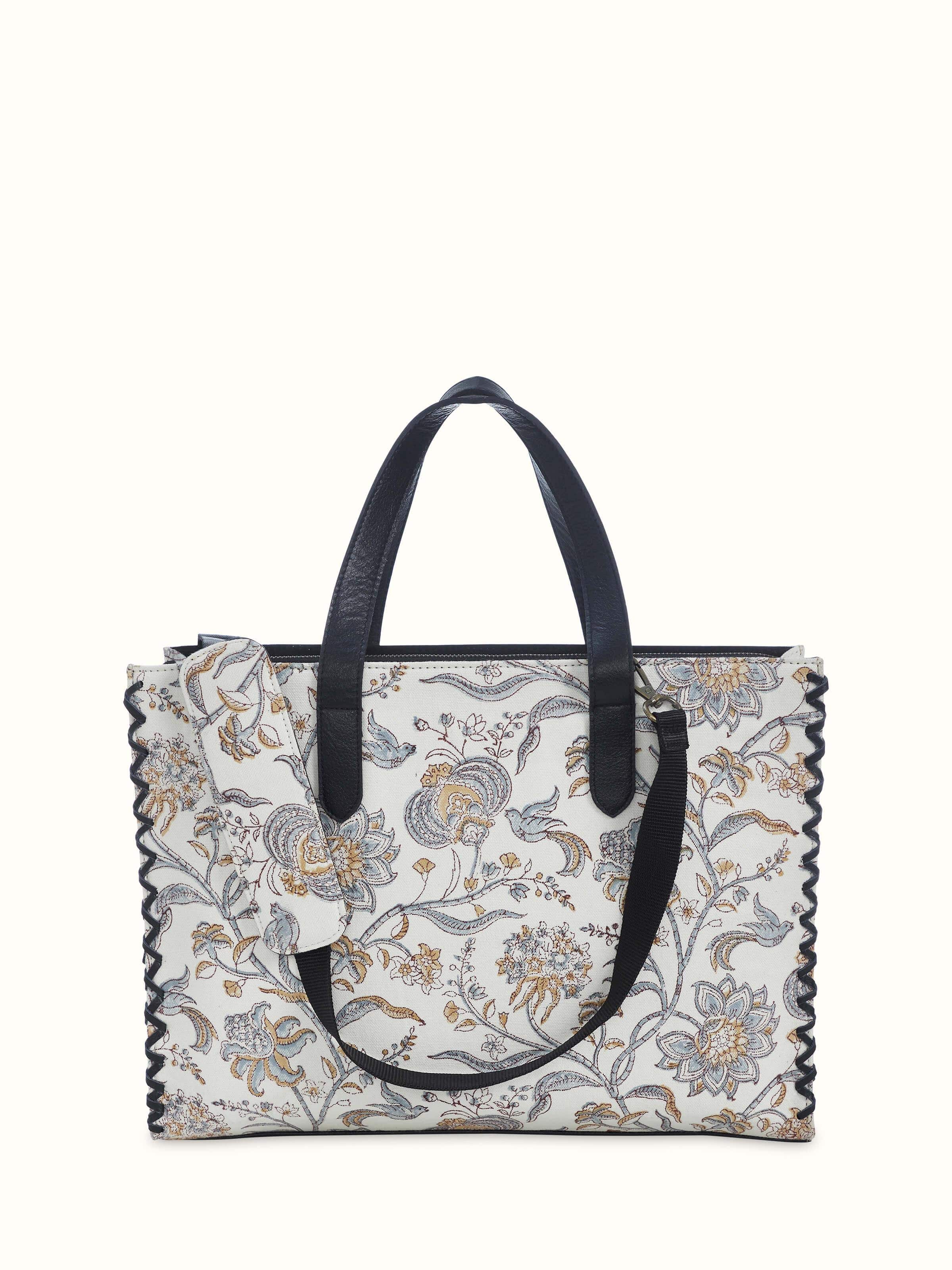 Black leather and textile hand block printed tote bag back view displaying simple design and handles