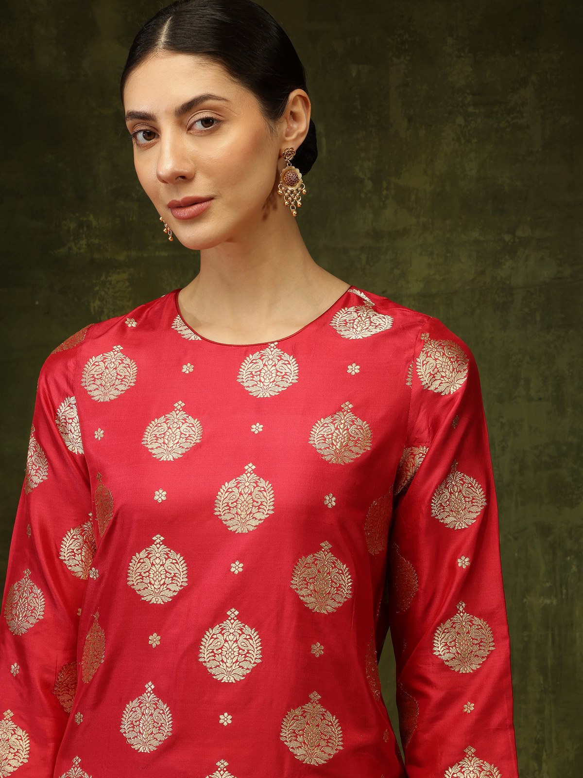 Close-up lifestyle view highlighting detailed Banarasi silk fabric on maroon kurta