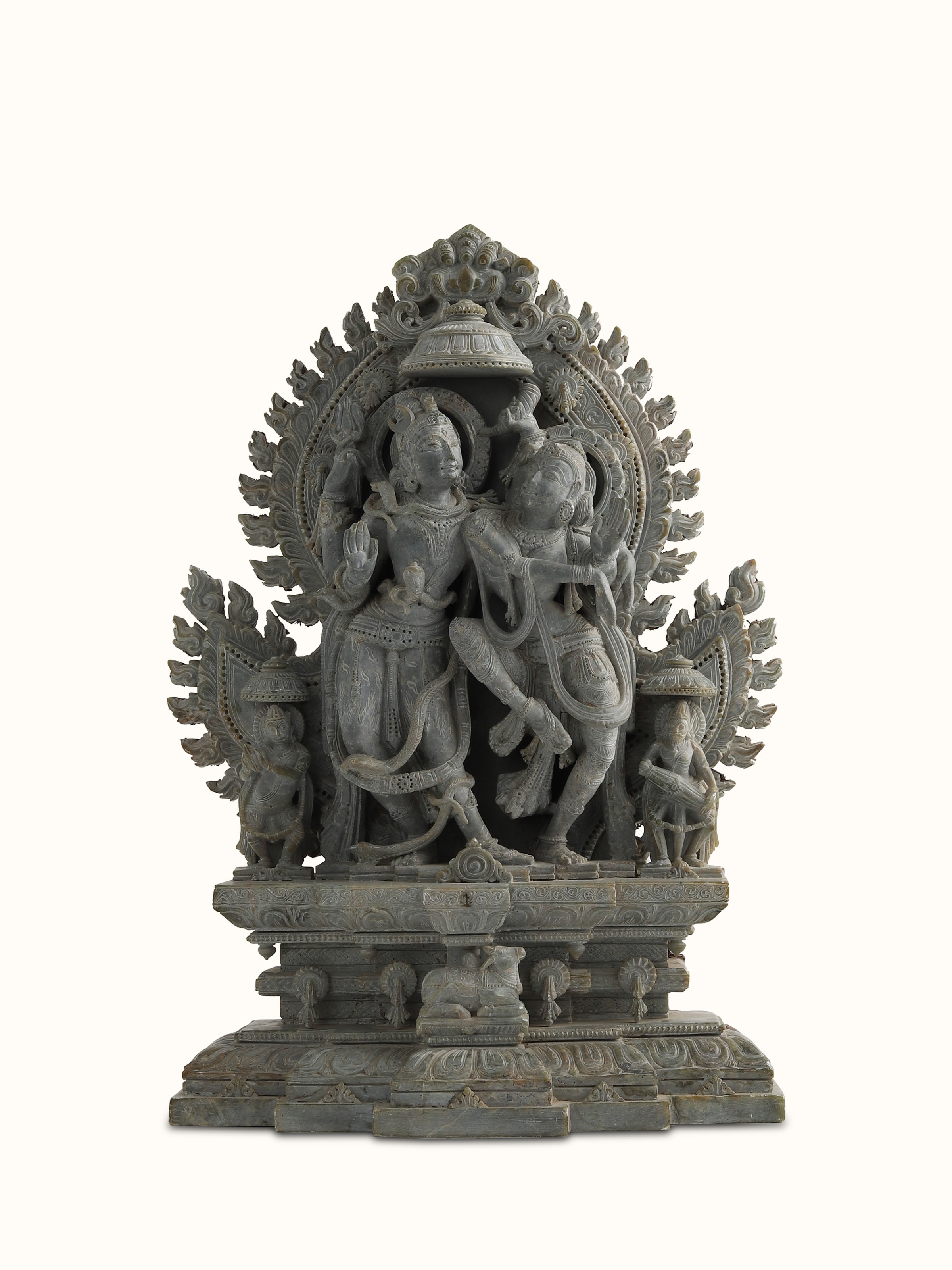 Front view of Stone Shiva Parvati Idol, showcasing the divine expressions and symmetrical stone craftsmanship.