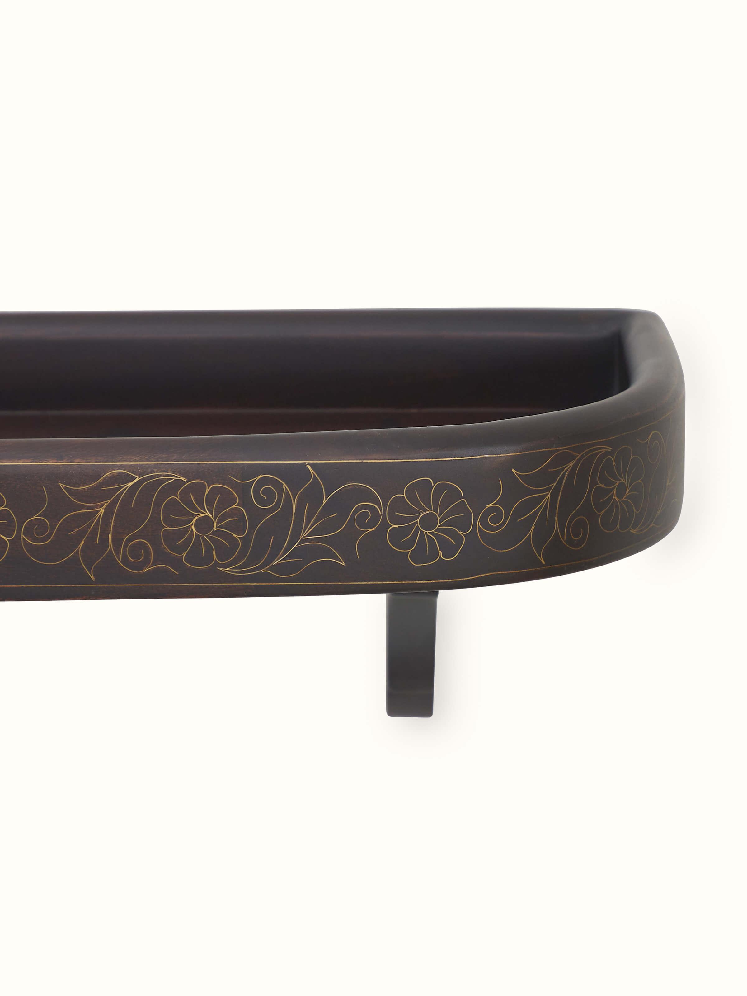 Detailed view of Sheesham Wood & Brass Tarkashi Wall Shelf, showcasing its polished wood and elegant brass inlay