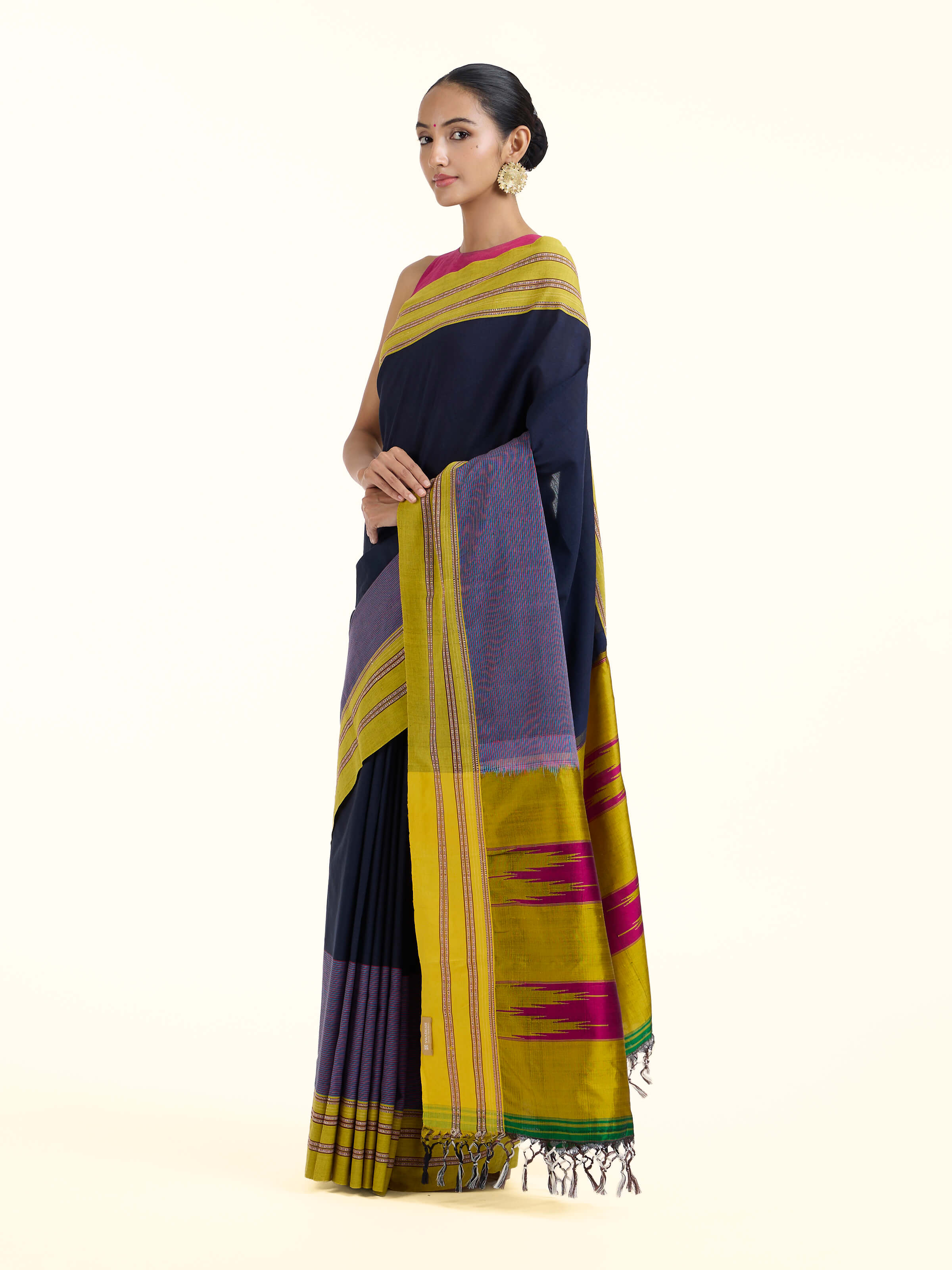 Side view of navy blue cotton and silk Ilkal saree highlighting graceful drape and contrast border