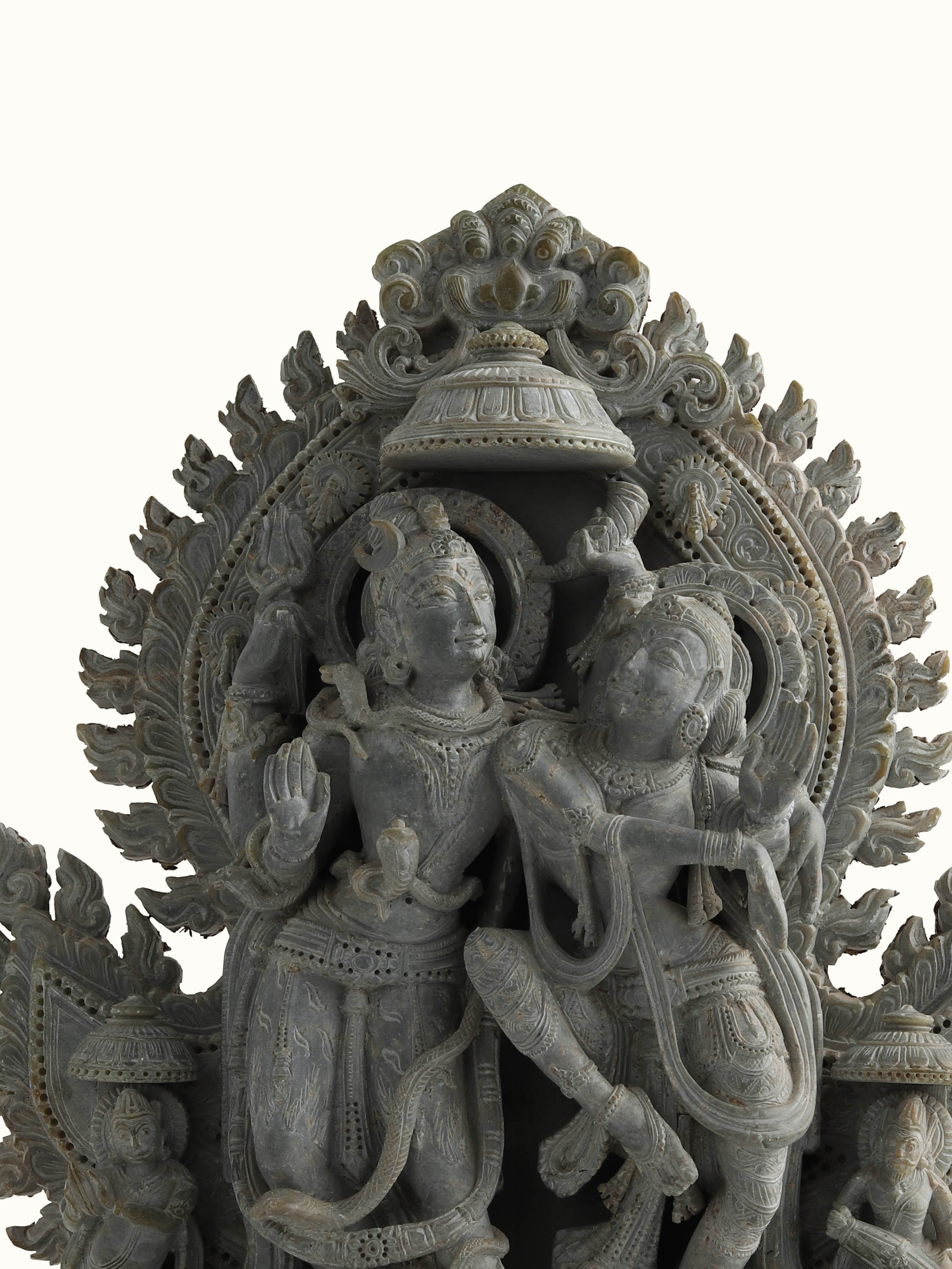 Detailed view of Stone Shiva Parvati Idol, focusing on the ornamental stonework and spiritual essence.