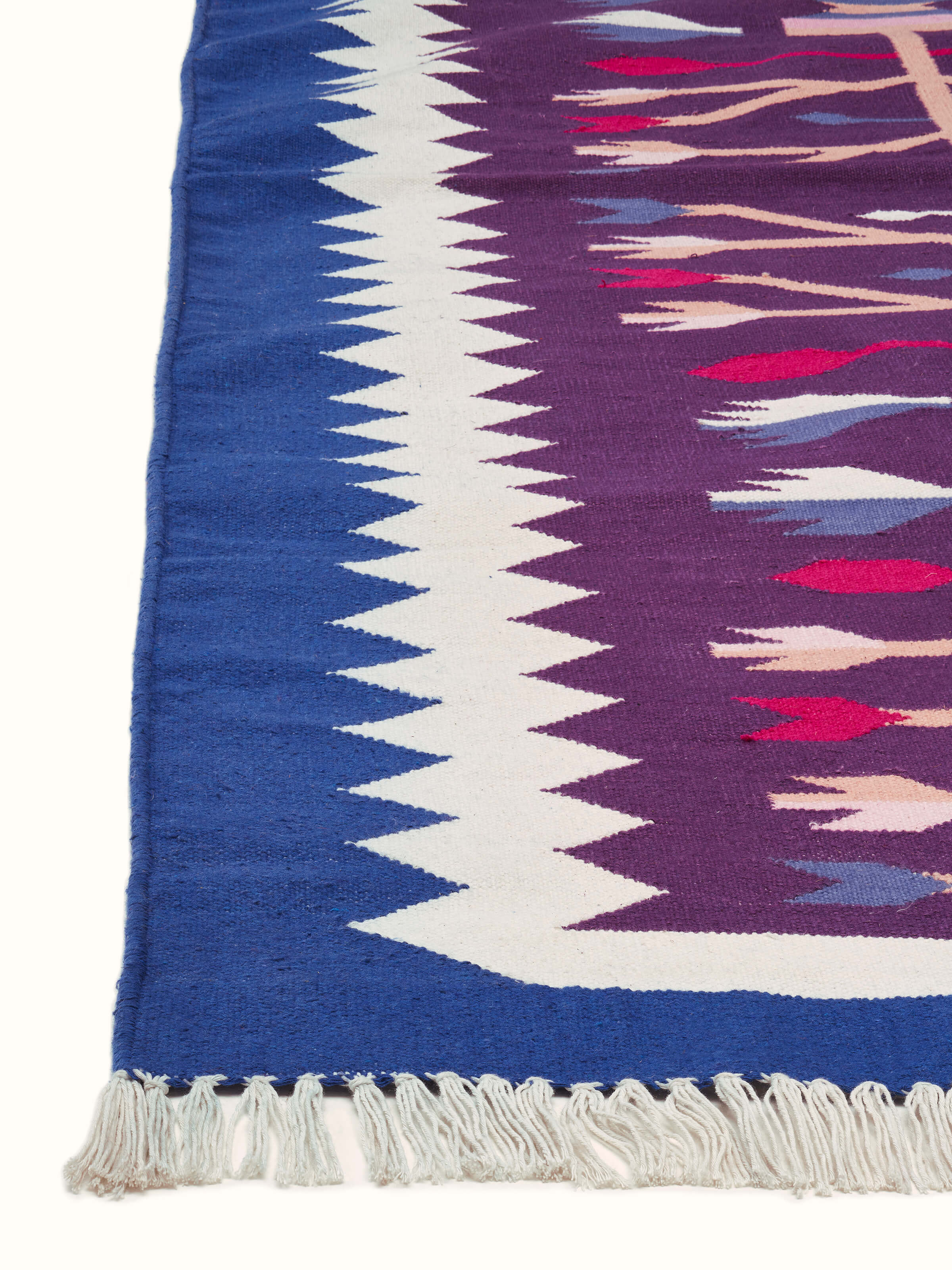 Close-up highlighting the intricate Kilim floral motifs and cotton weave texture