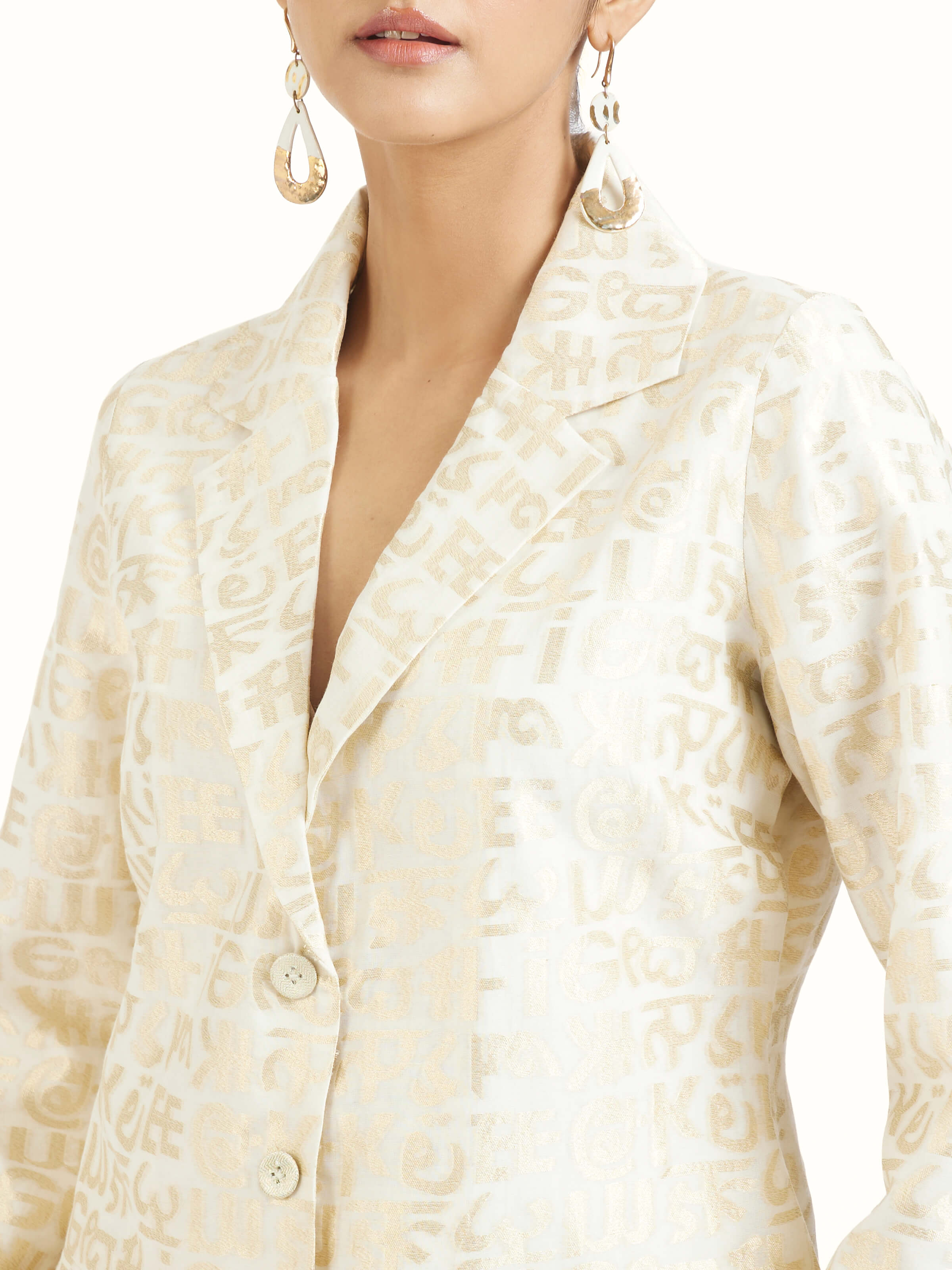 Detail view of ivory handloom cut work calligraphy co-ord set showcasing fine craftsmanship