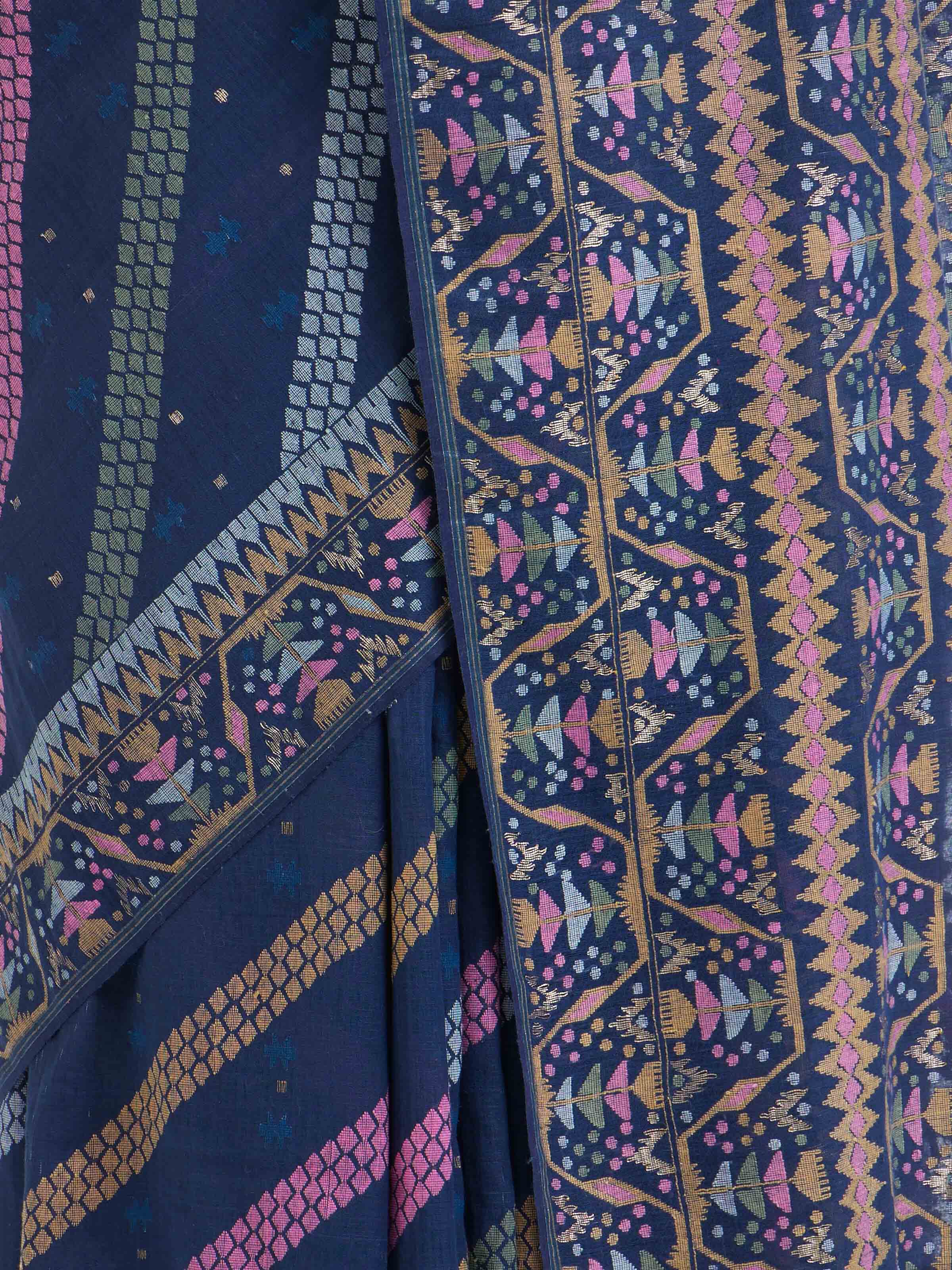 Detail view of indigo cotton Bengal Jamdani saree showing handwoven texture