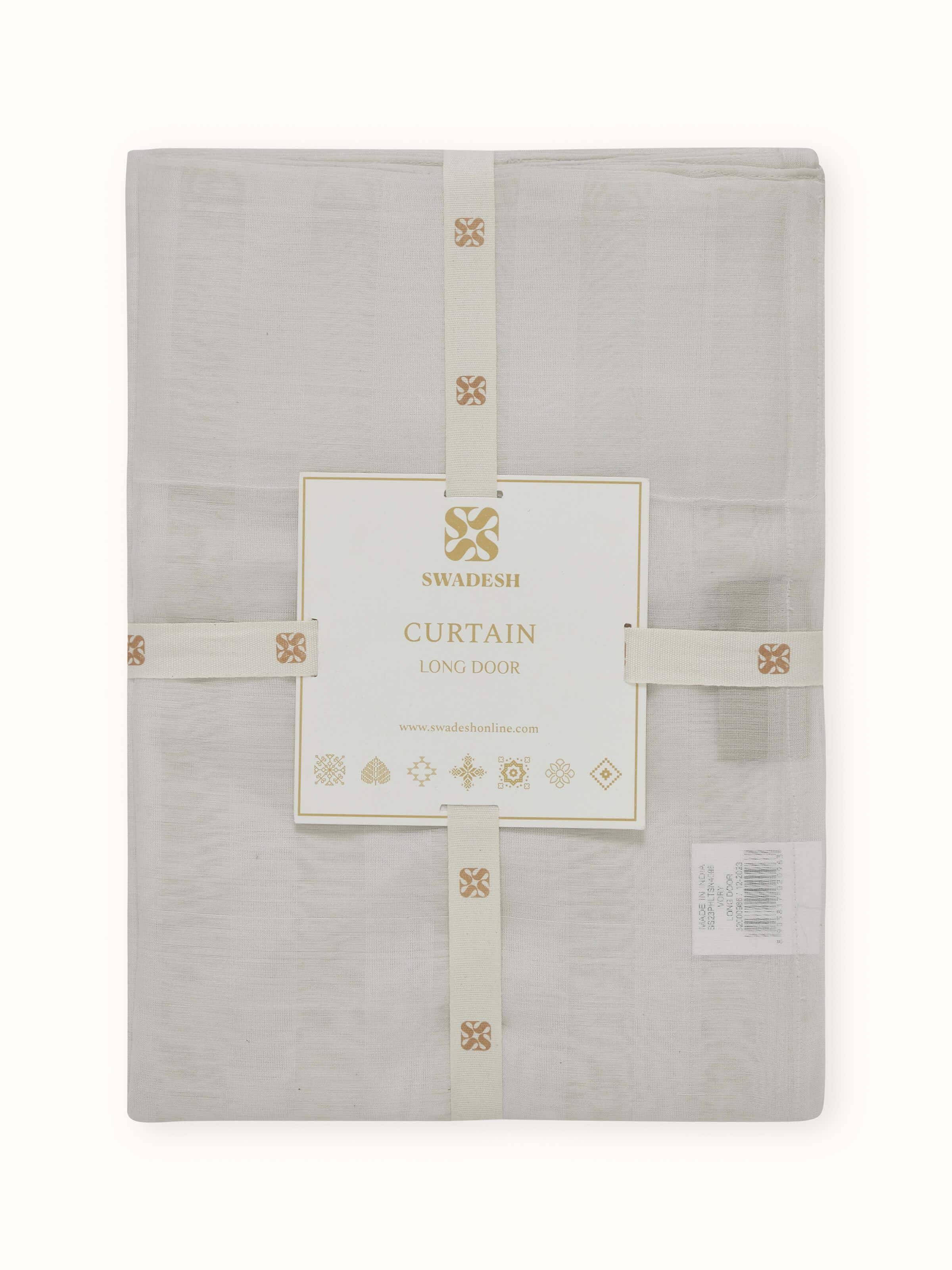 Detail shot highlighting texture and stripe variation on ivory sheer Maheshwari curtain.