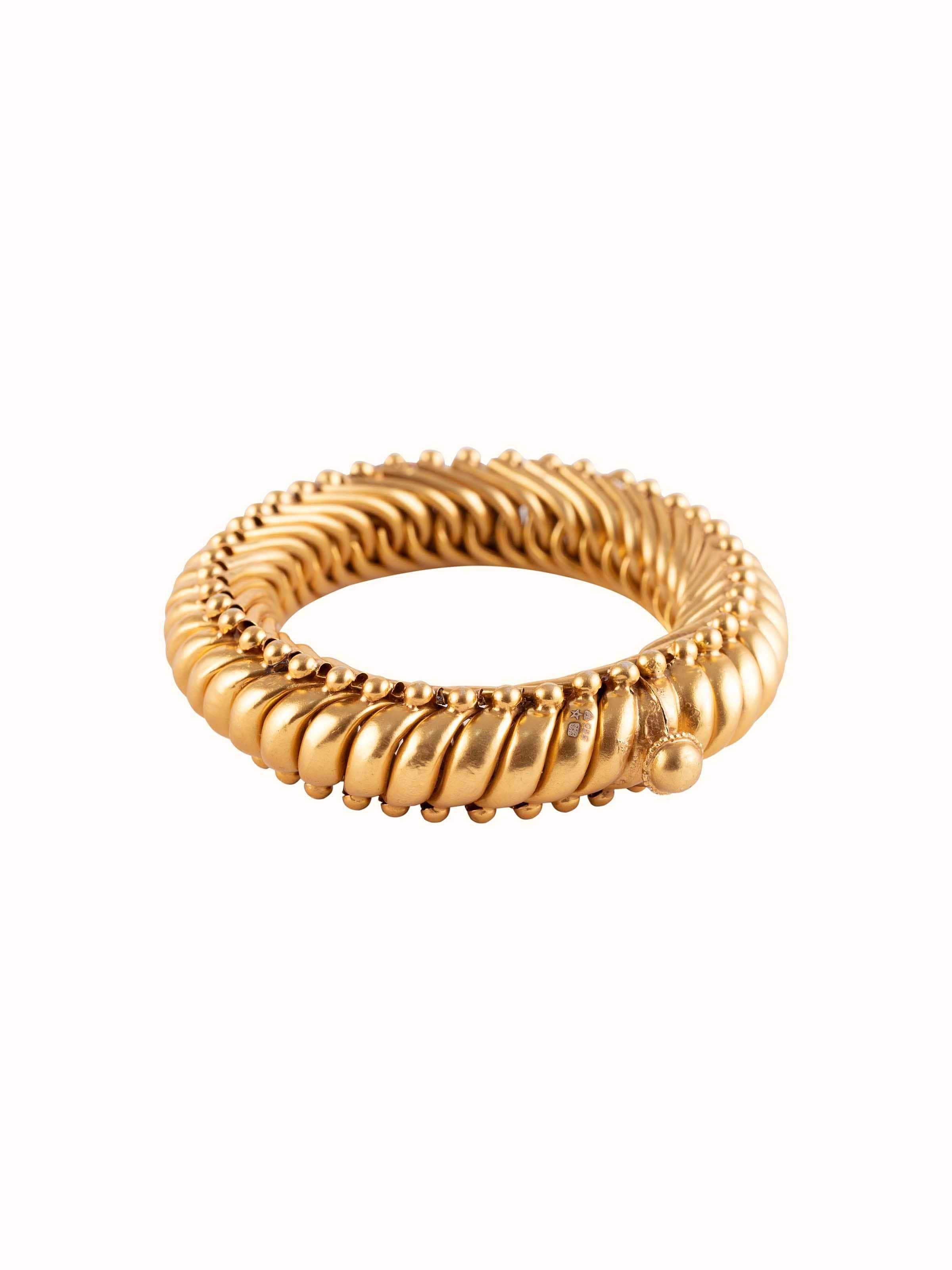 Front view of Smithing Bangle showcasing the intricate metalwork and traditional design