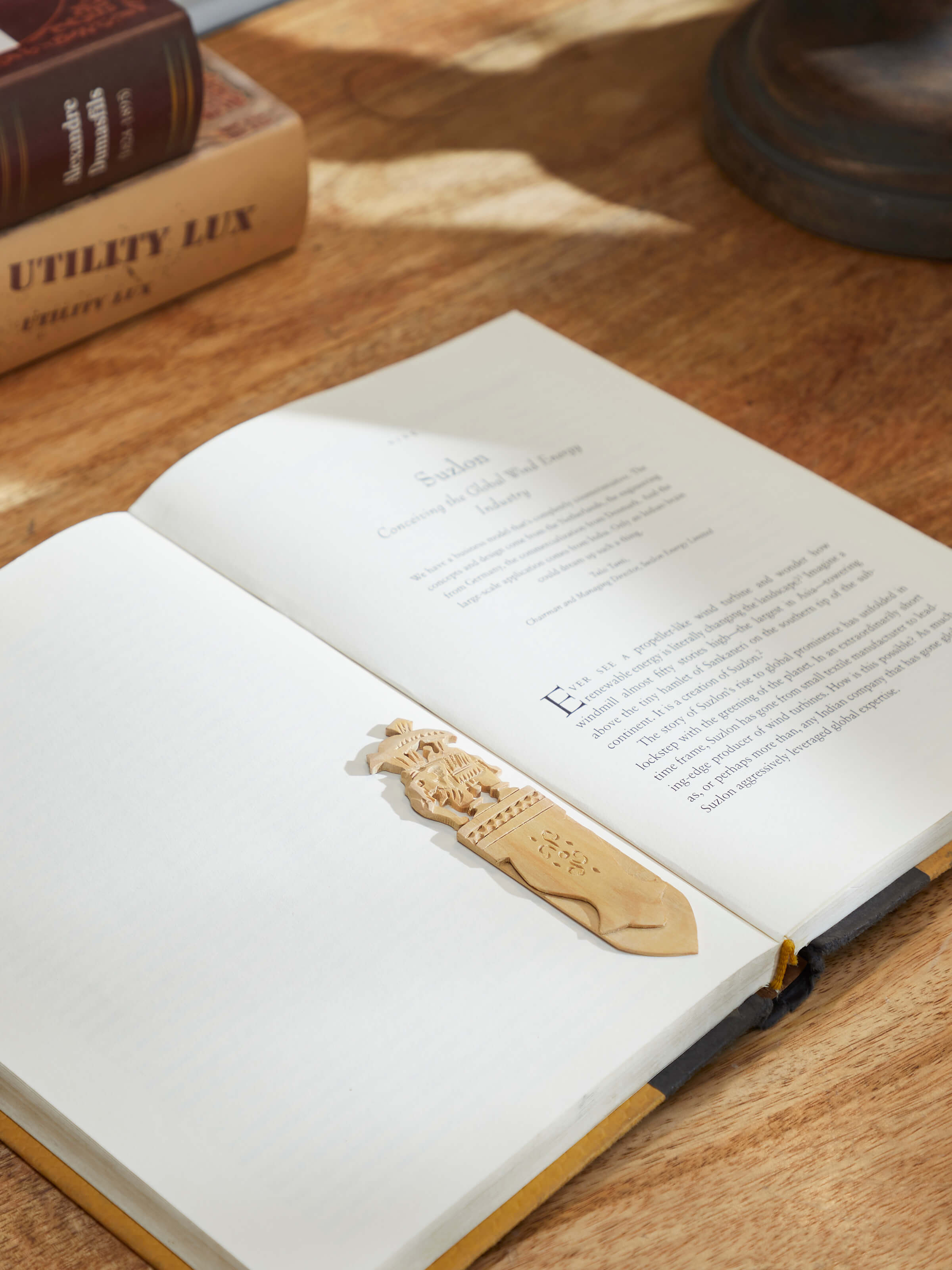 Side view of Carved Sandalwood Elephant Bookmark by Swadesh emphasizing the intricate carving and polished sandalwood design.