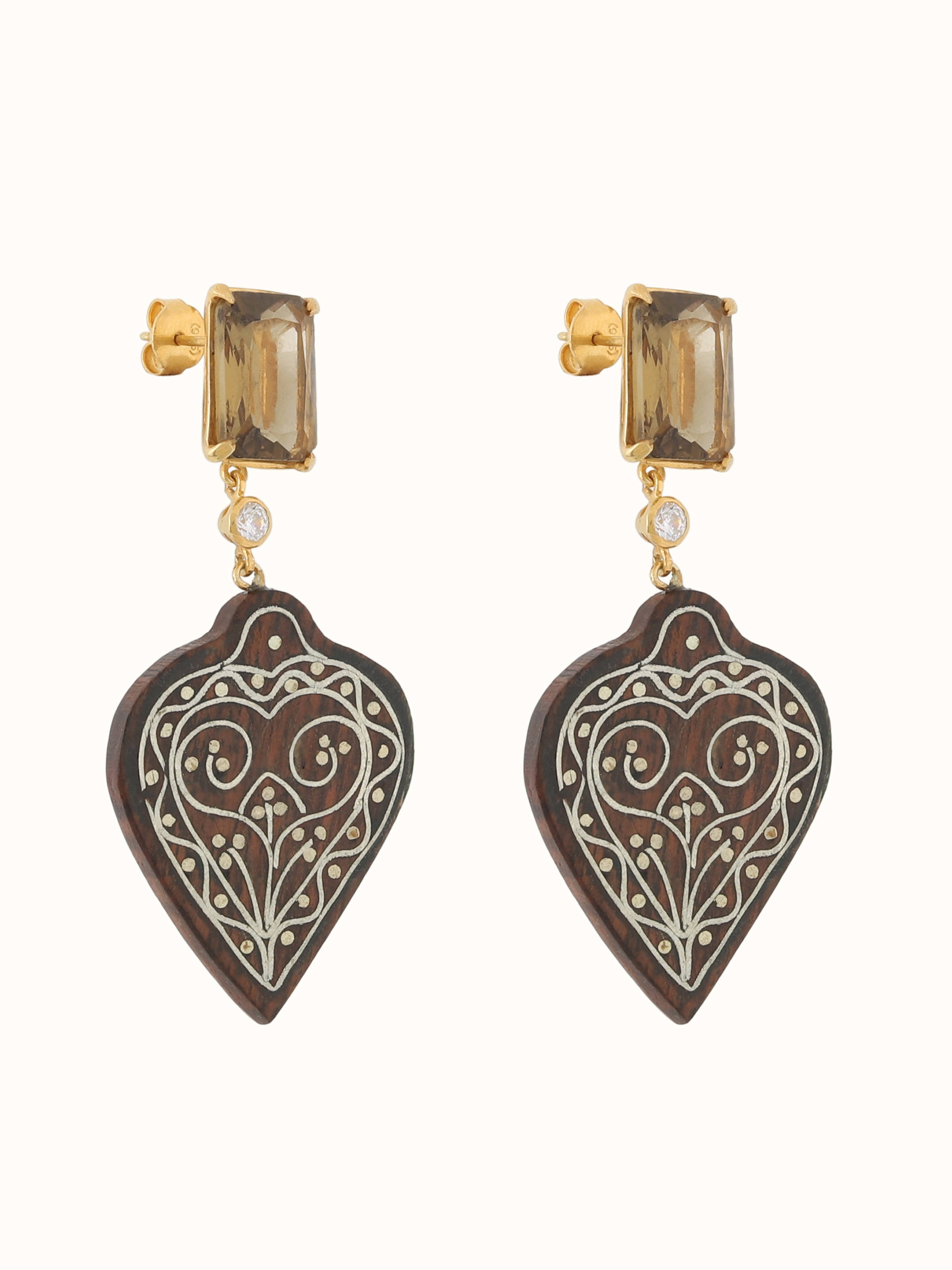 Angled view of silver Tarkashi earrings revealing handcrafted geometric structure
