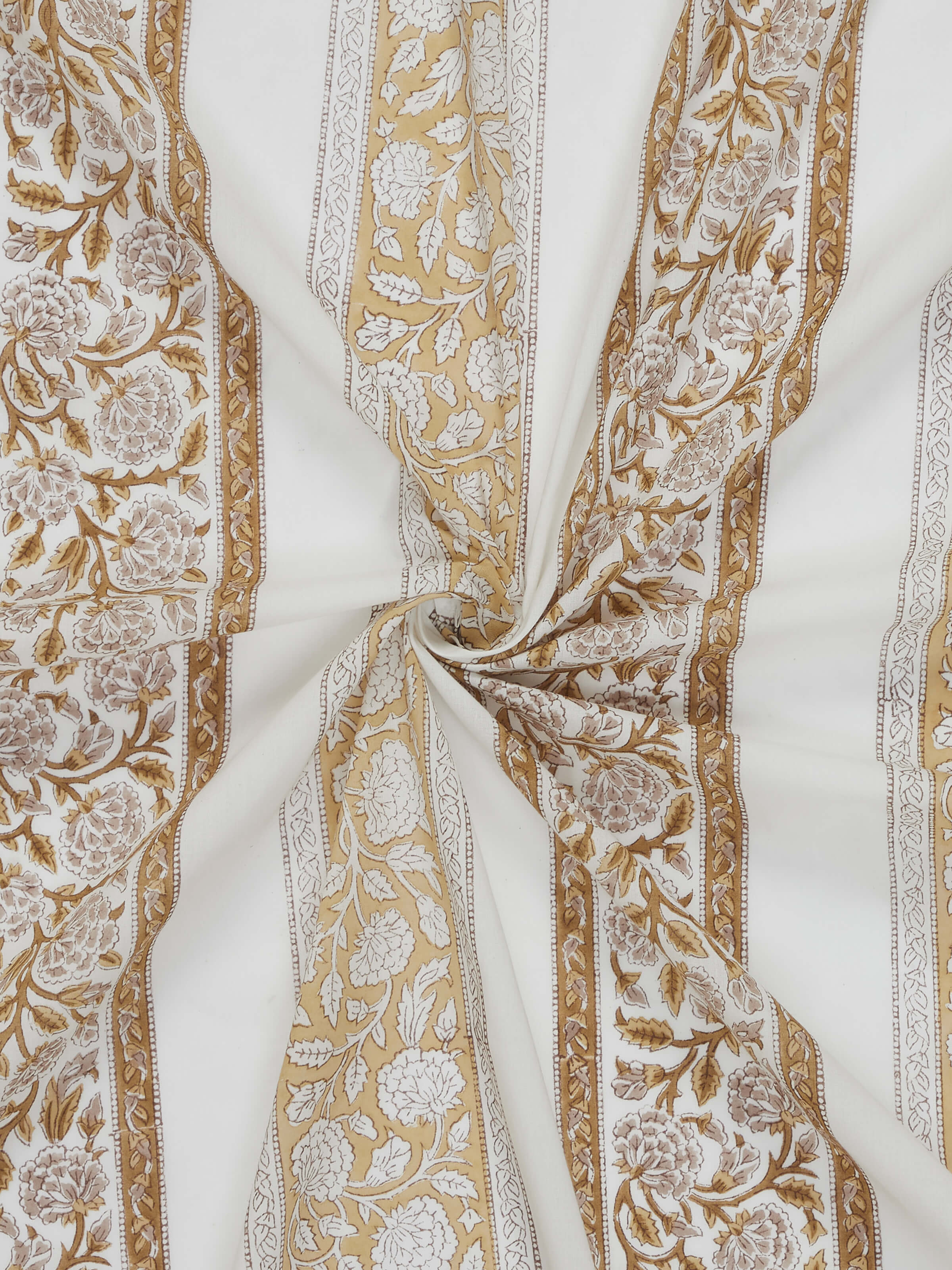 Close-up of floral stripe Sanganeri hand block print on brown cotton curtain