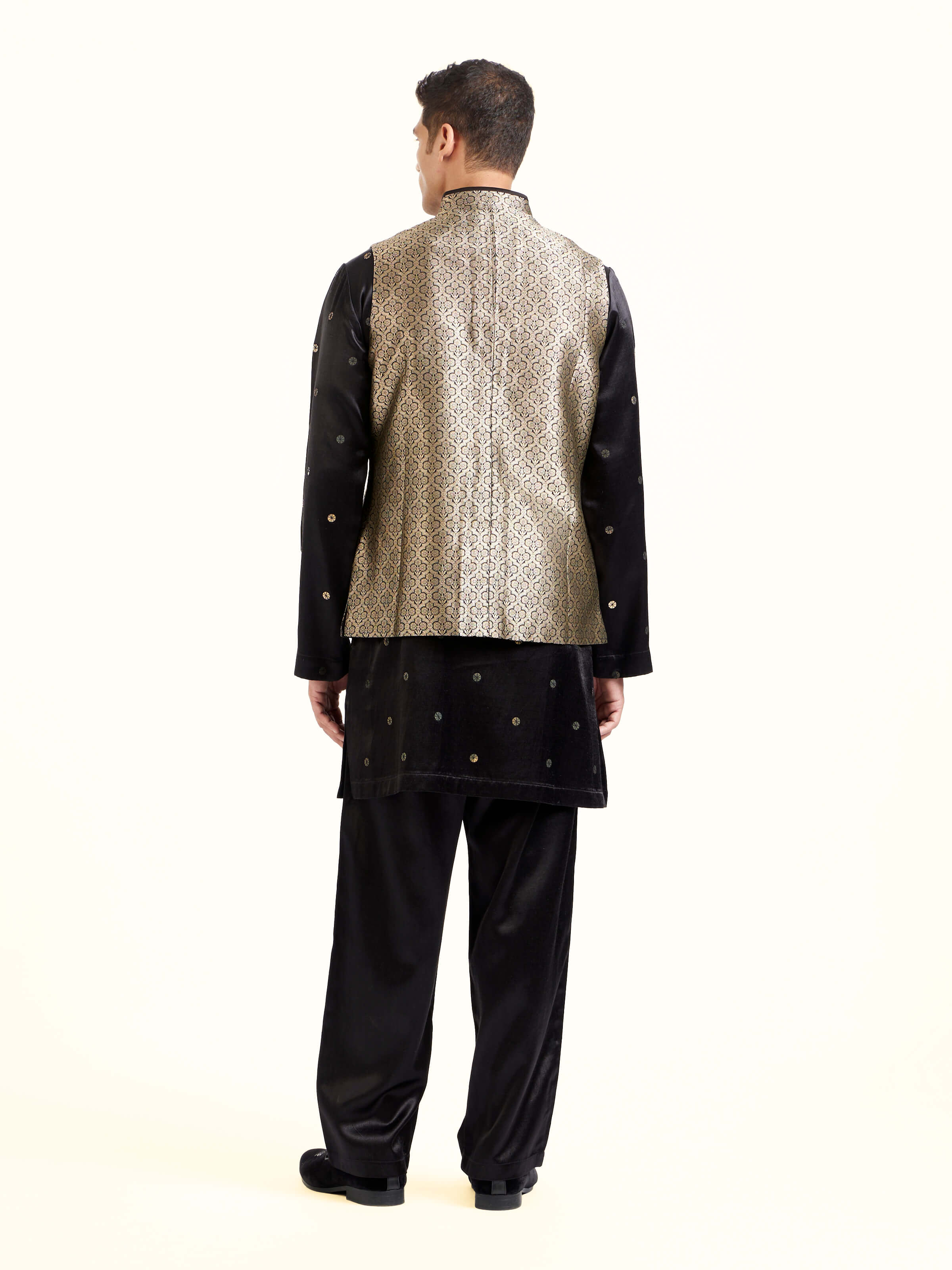 Back view of black silk Banarasi sleeveless jacket displaying structured finish