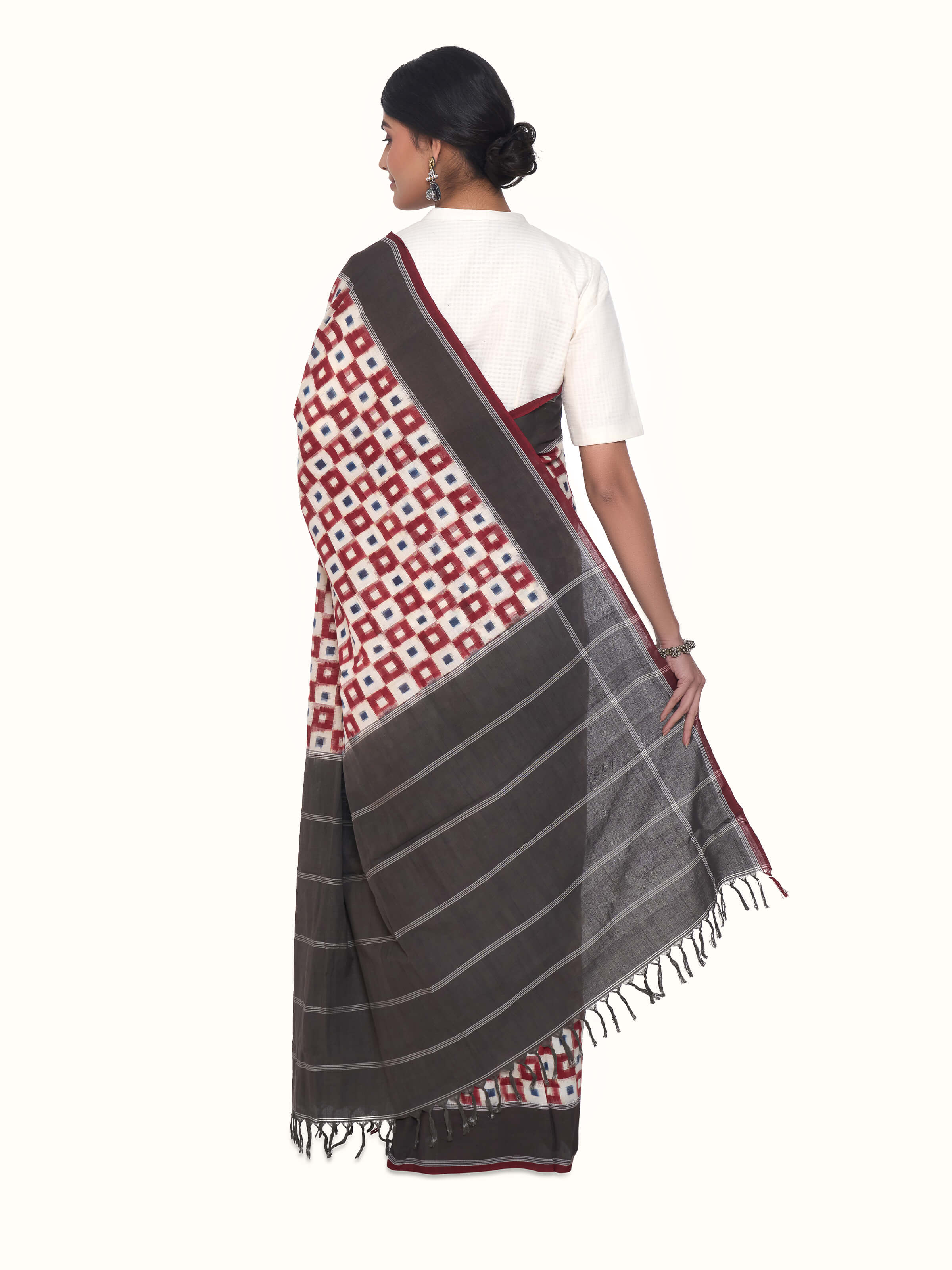 Back view of brown cotton double ikat saree displaying pallu design