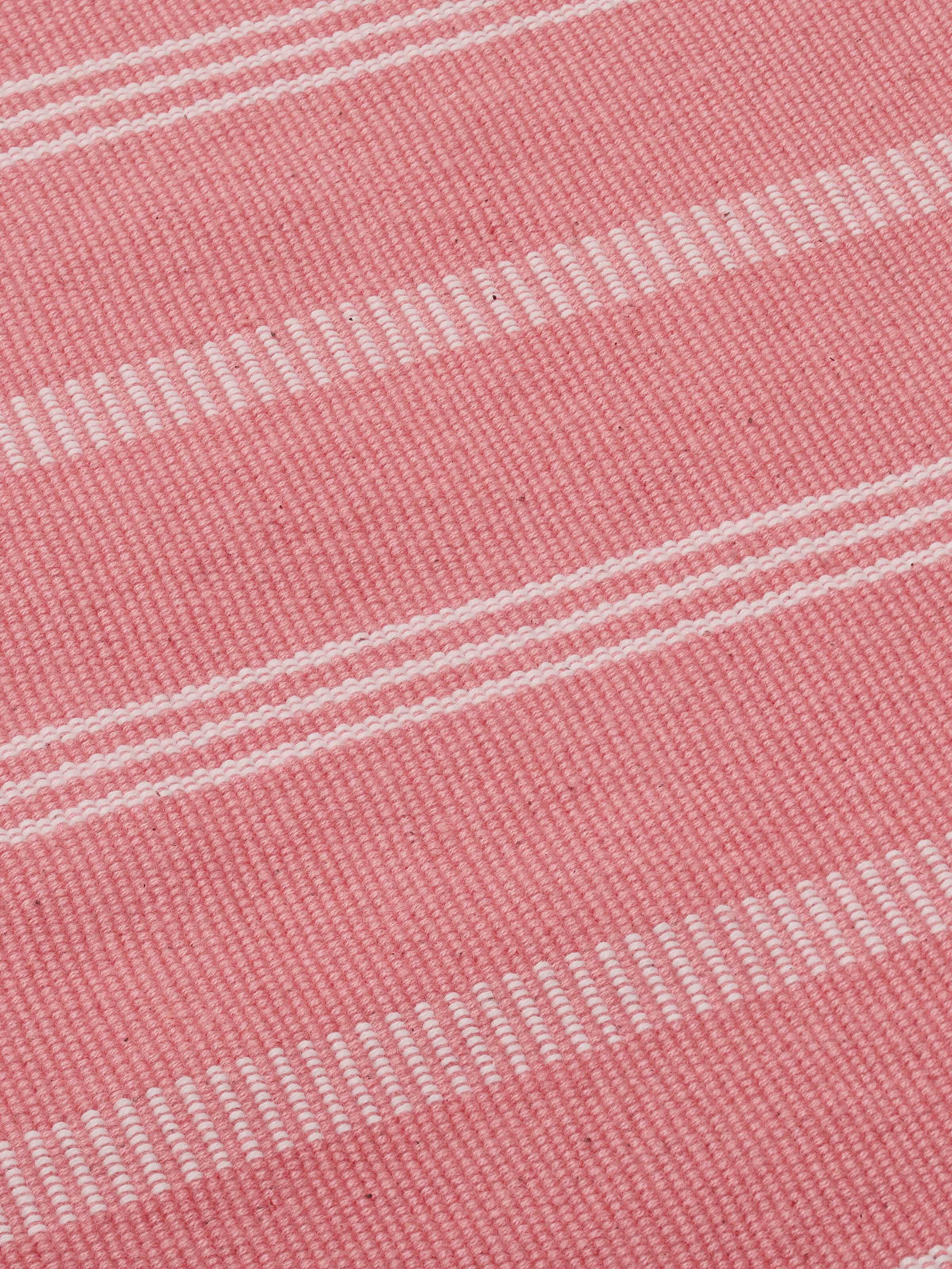 Side perspective emphasizing the smooth texture and vibrant pink hues