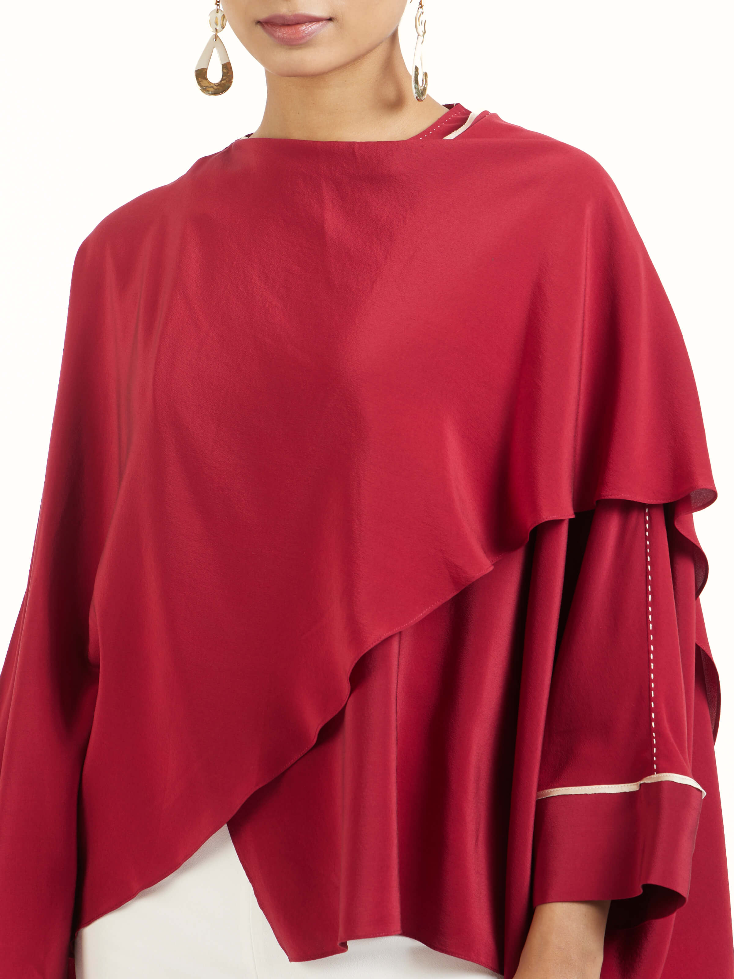 Detail view of red silk handloom top showing handwoven silk