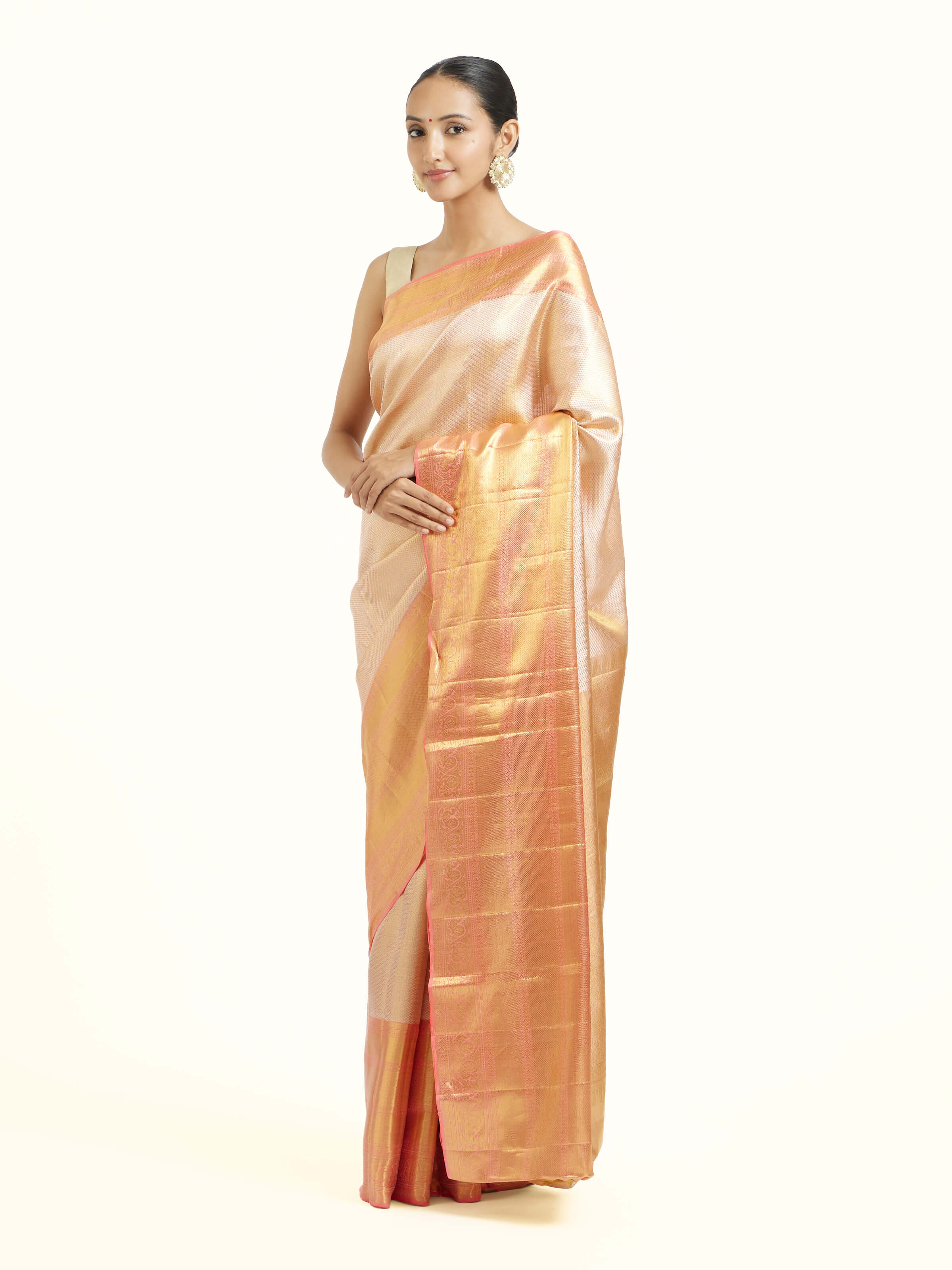 Side view of beige silk Kancheepuram saree showcasing elegant drape