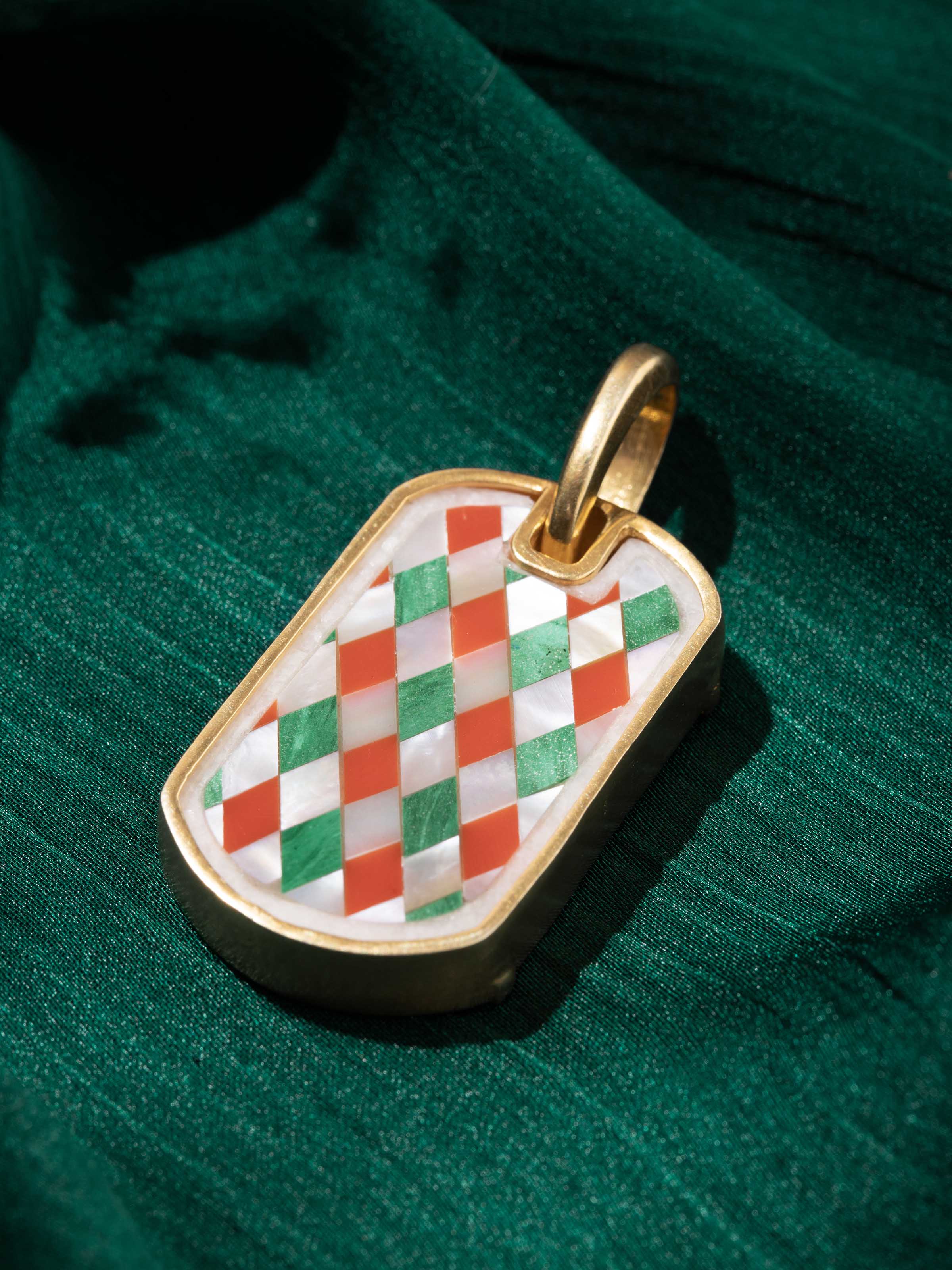 Detail shot focusing on handcrafted inlay and textural silver detailing.