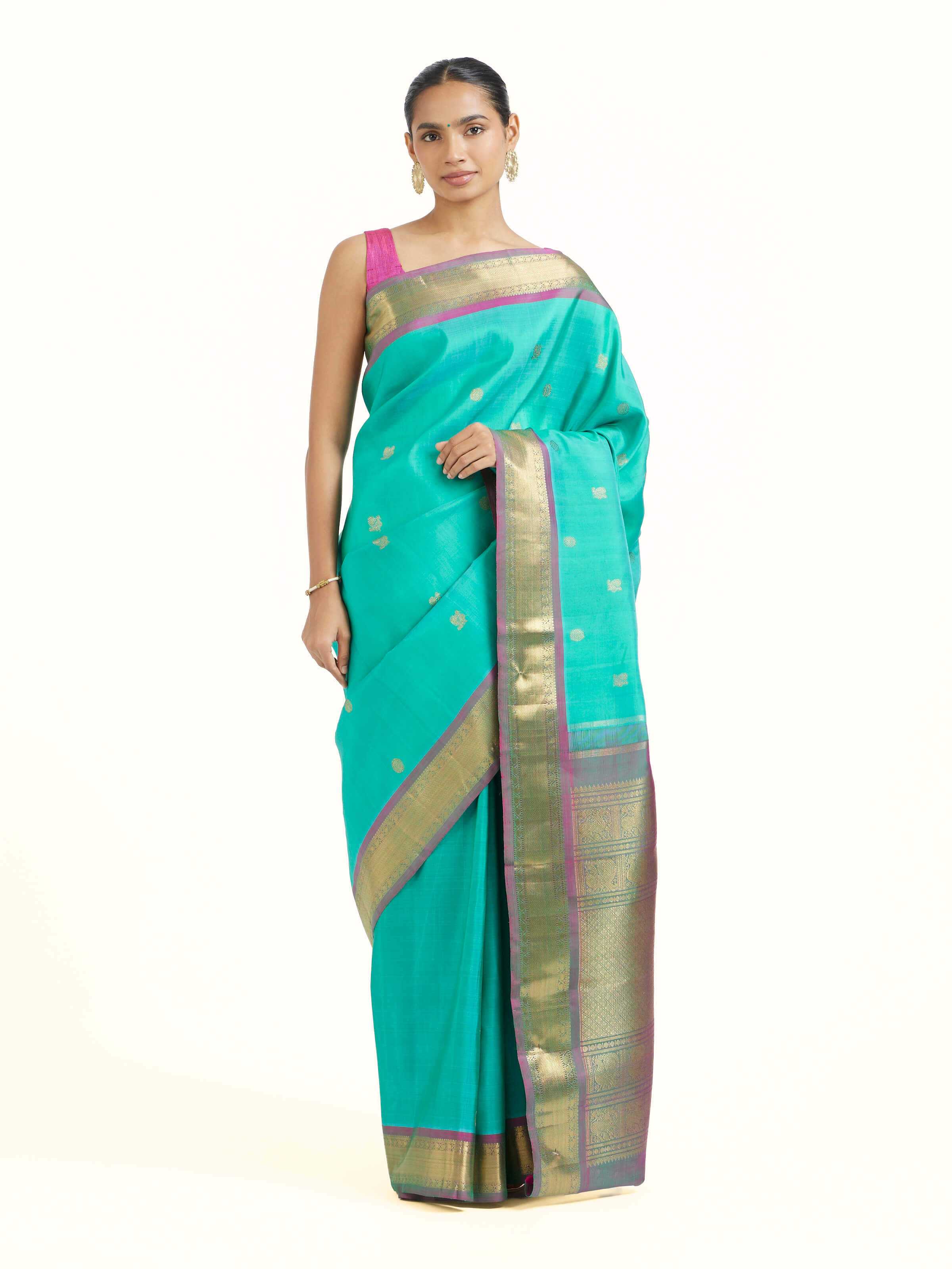Front view of blue silk Kancheepuram saree with intricate zari motifs