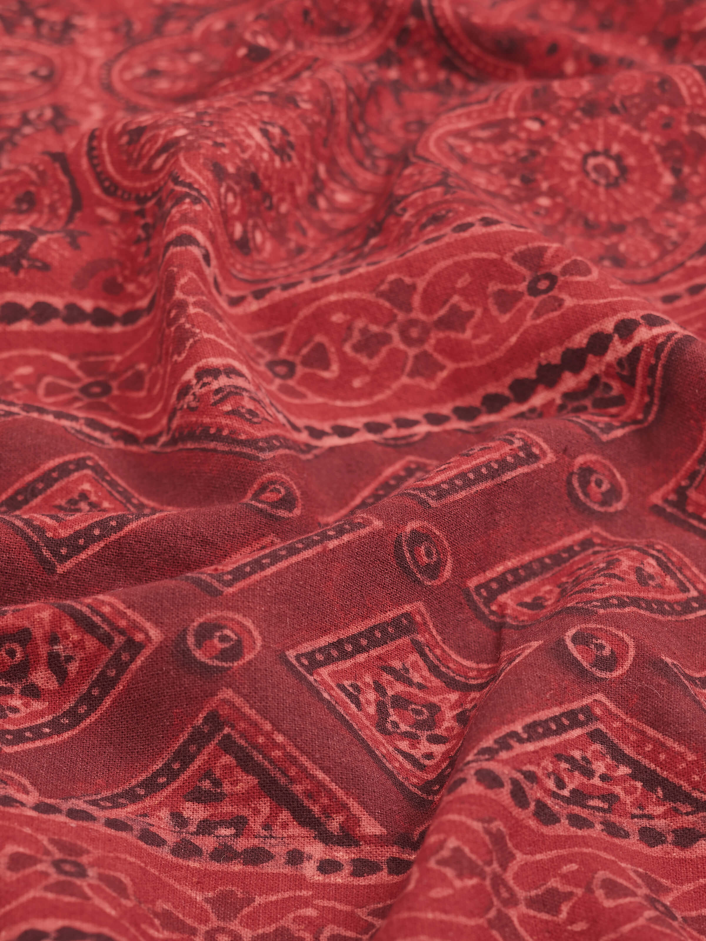 Sindh maroon jaal cotton ajrakh block printed king bedspread set (3 pcs) displayed on a bed to show the full set and design.