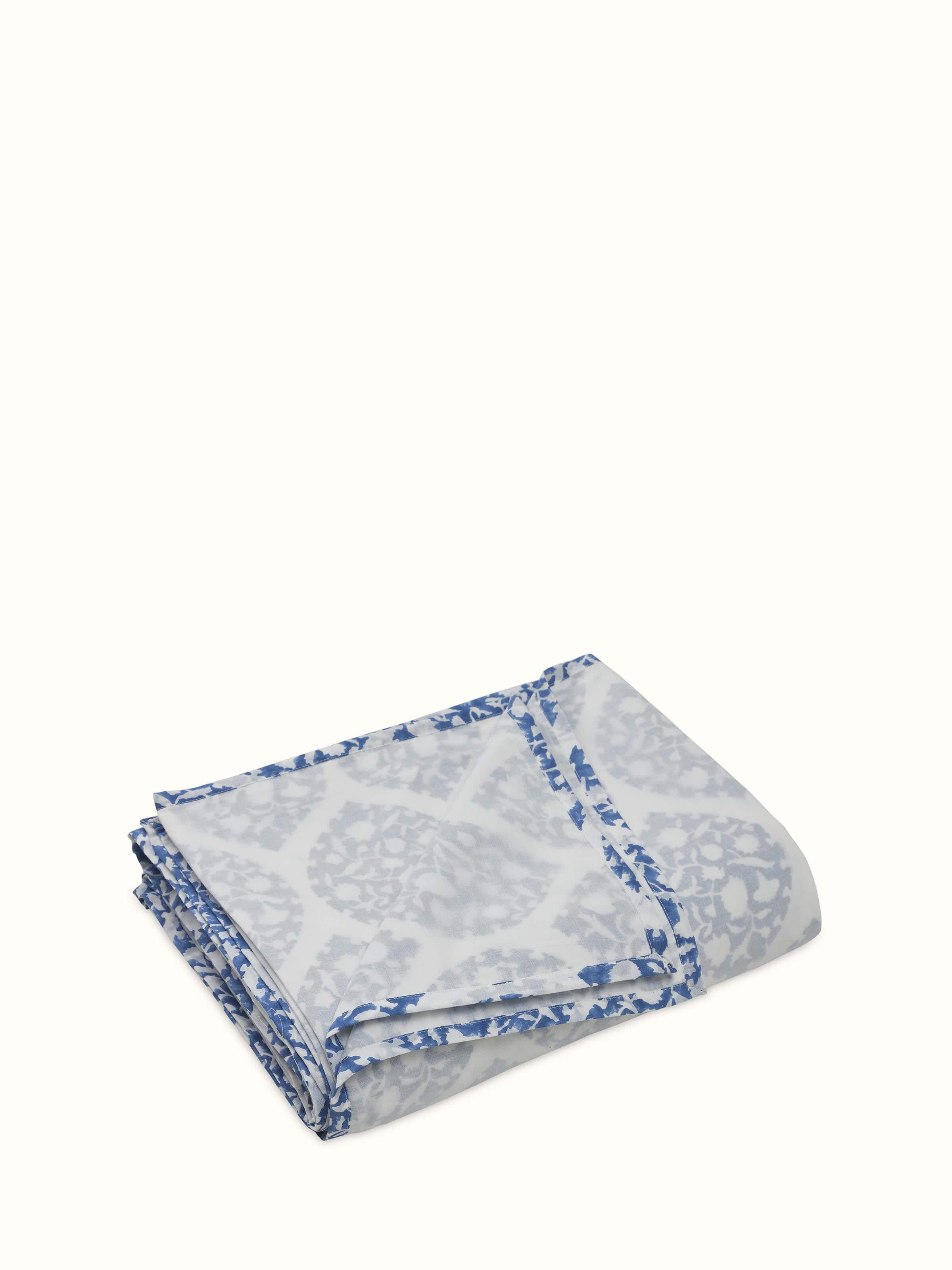 Angled view of folded dohar highlighting print alignment and fabric quality.