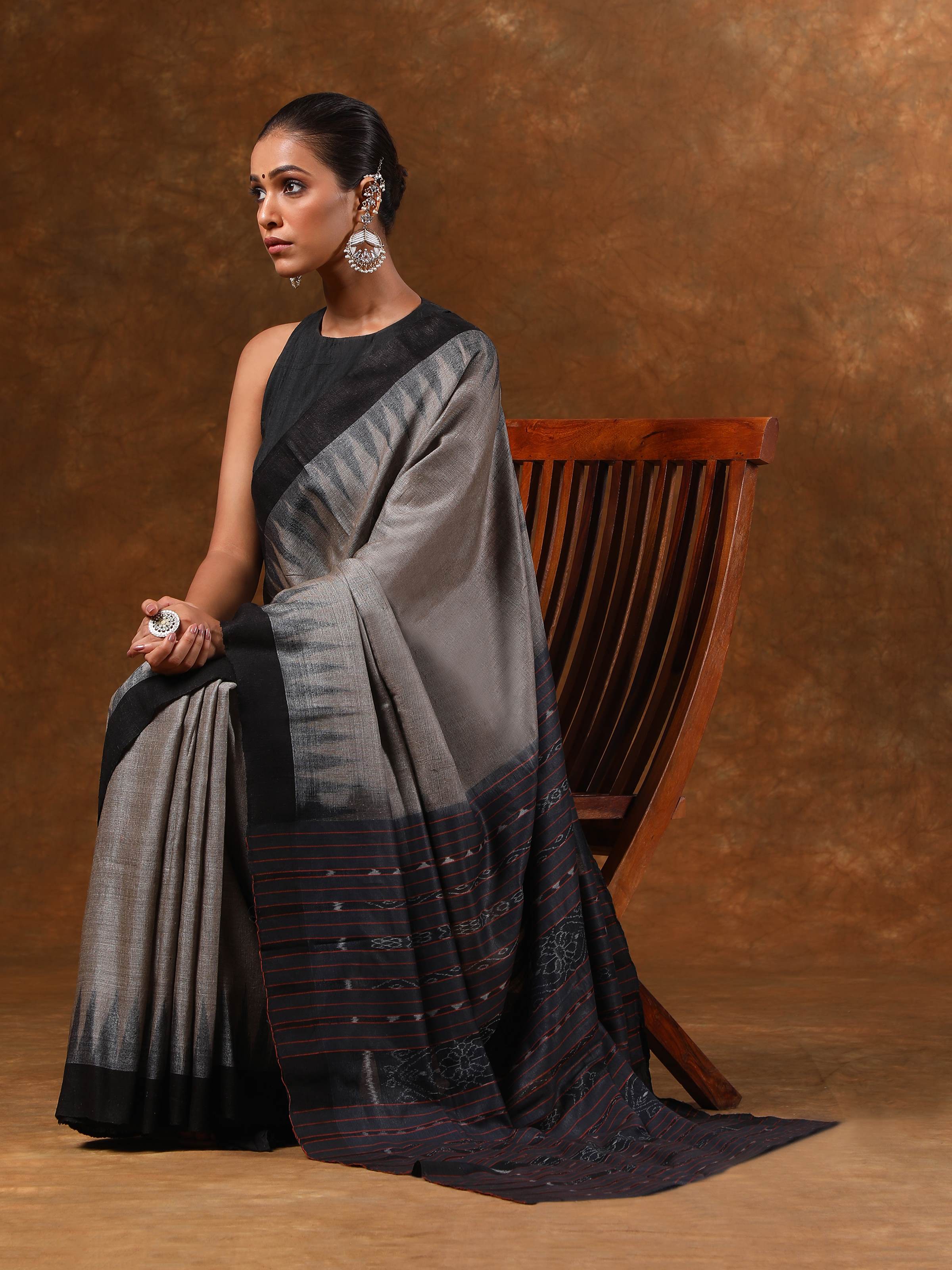 Lifestyle view of Odisha Ikat green Tussar silk saree styled with blouse