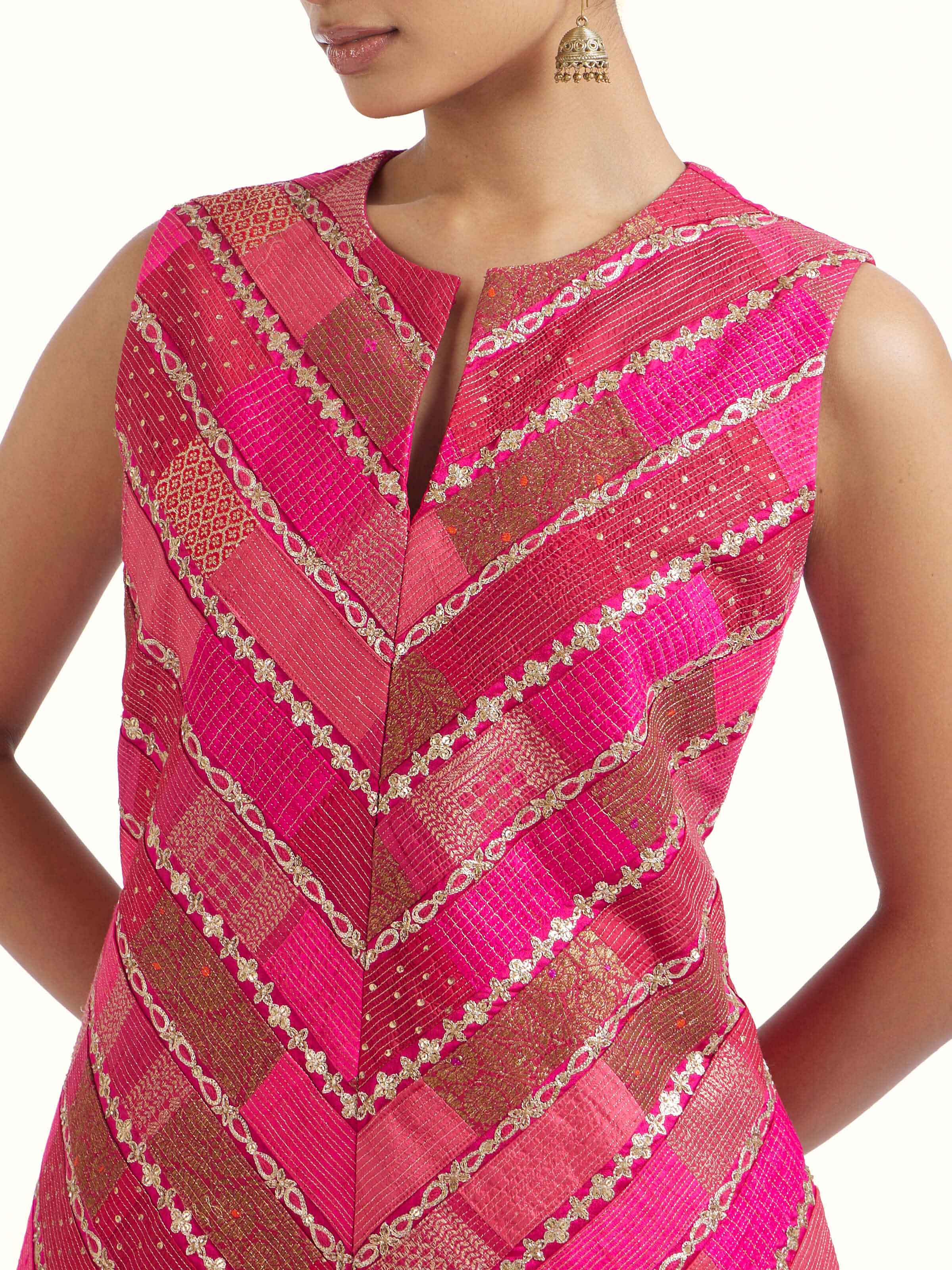 Detail view of pink silk hand embroidery kurta set showing embroidery and fabric texture