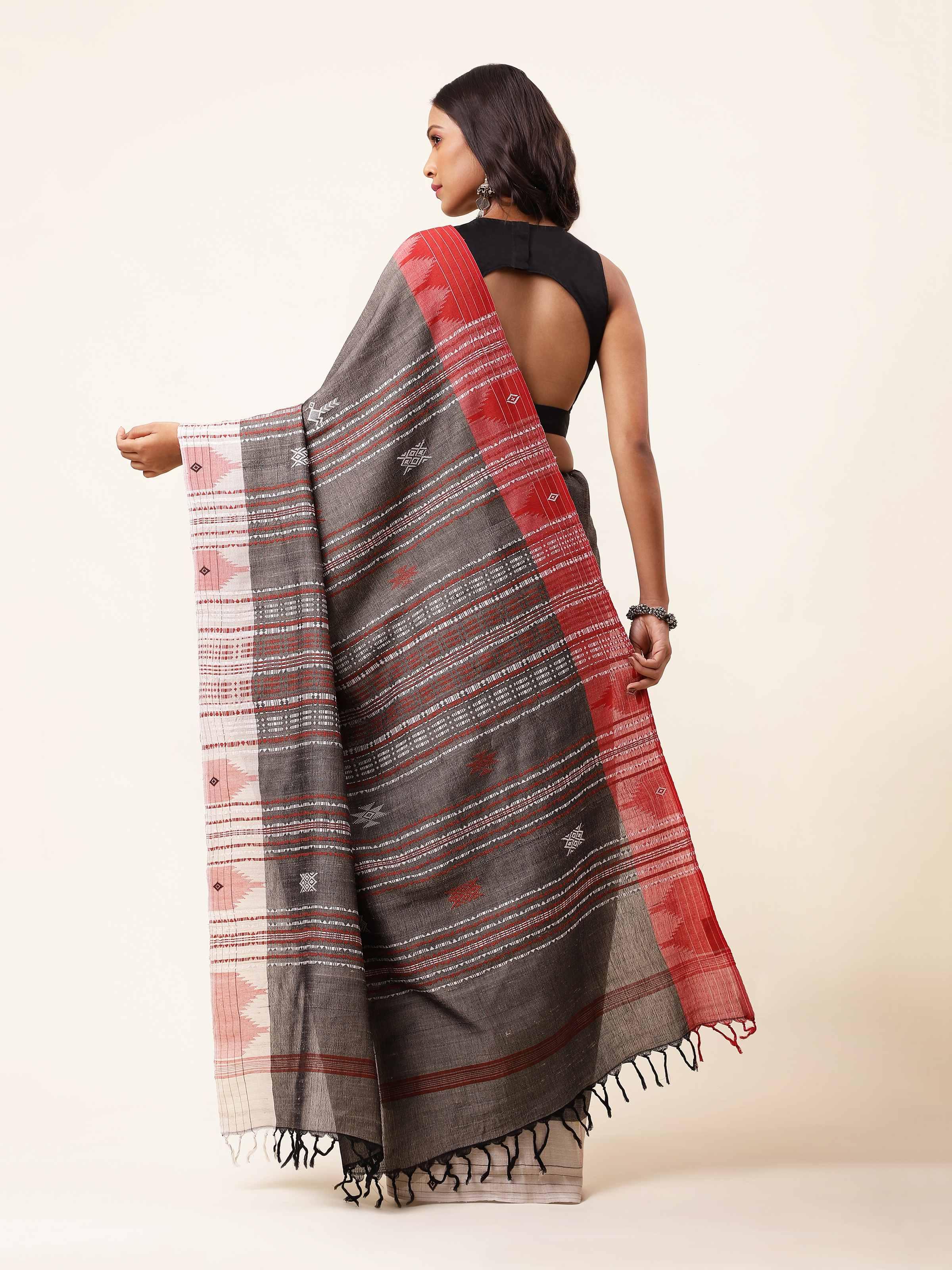 Back view of brown Tussar silk Kotpad saree with traditional patterns and rich texture