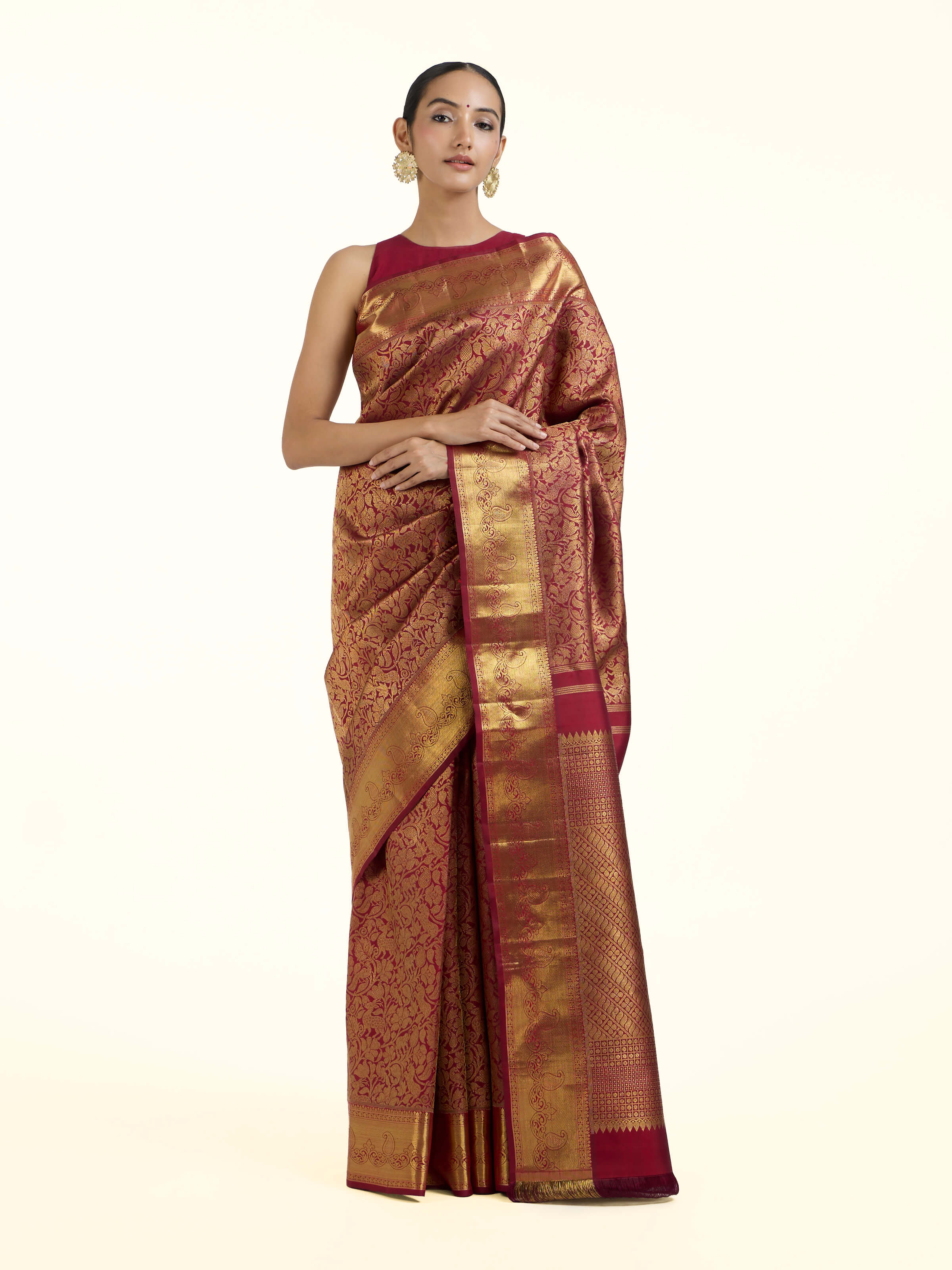 Front view of light pink silk Kancheepuram saree with rich zari border