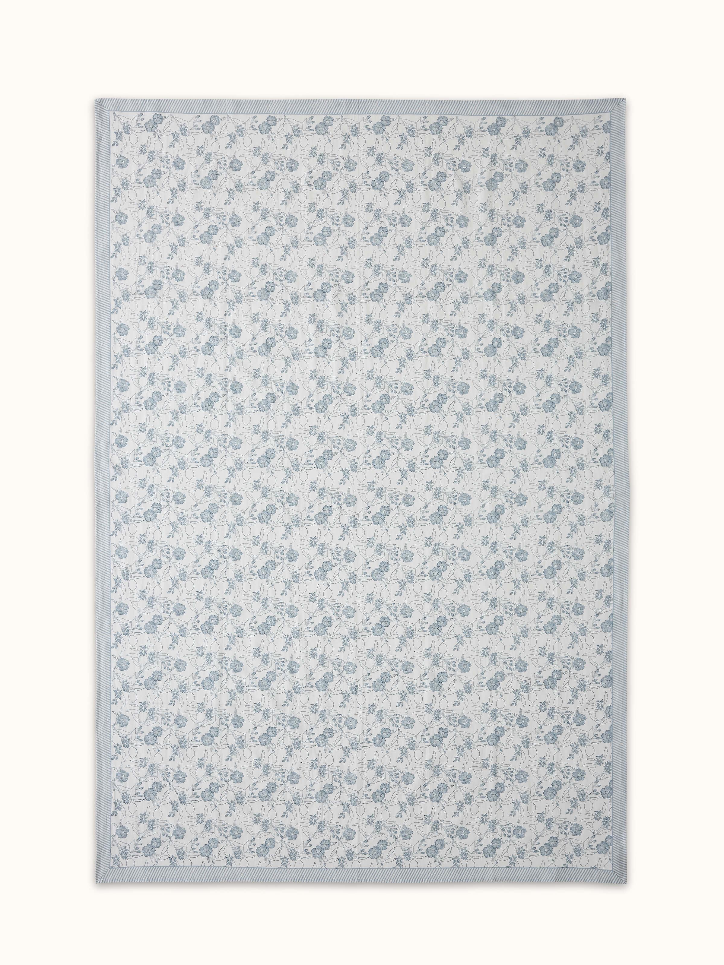 Front view highlighting the floral patterns and linen texture