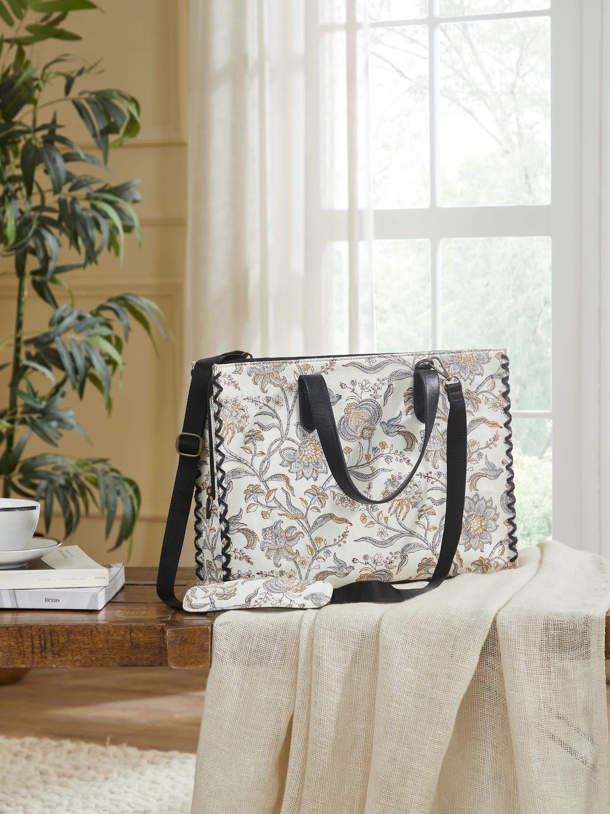 Black leather and textile hand block printed tote bag lifestyle view styled with casual outfit