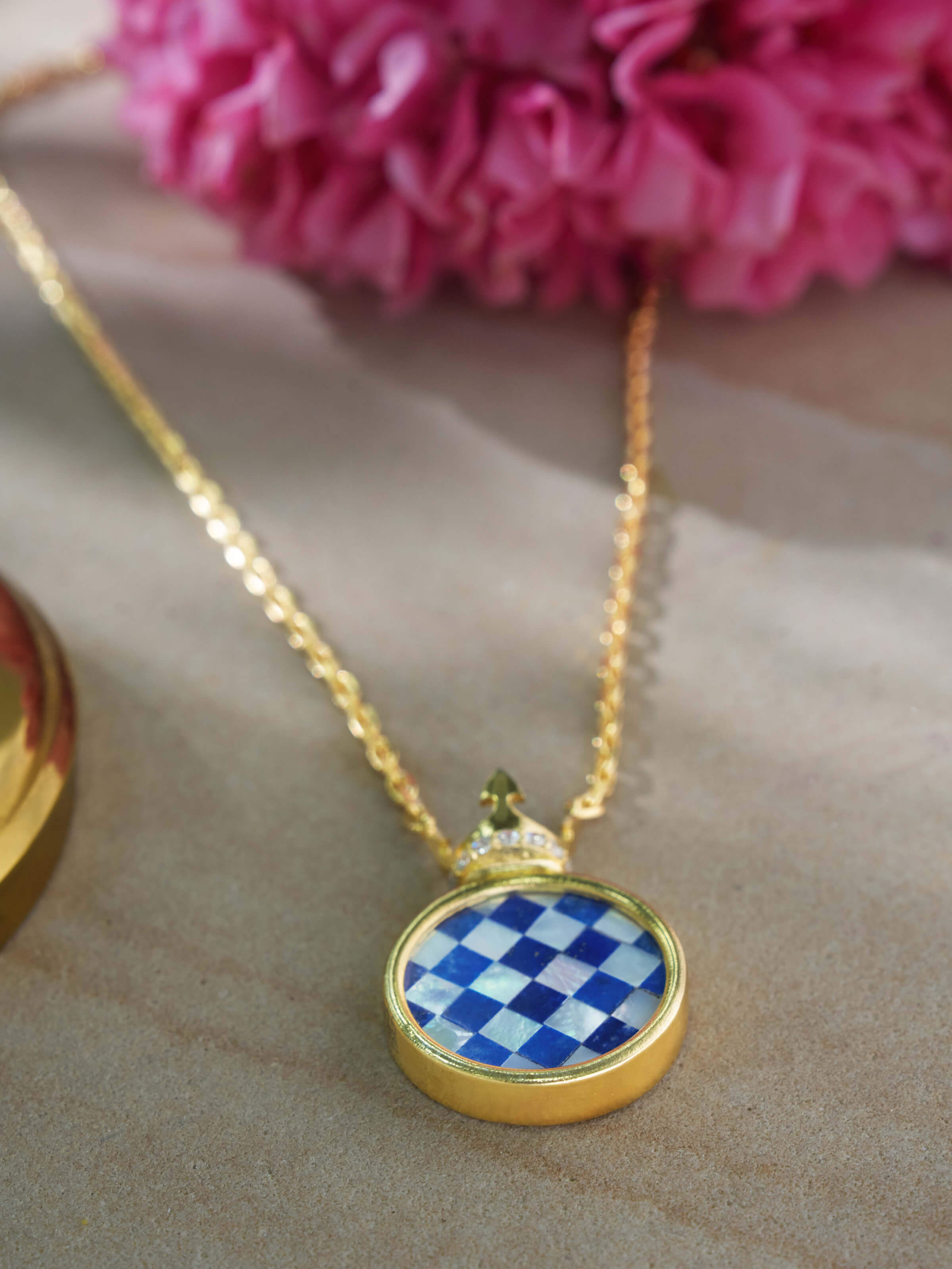 Angled view of Parchinkari silver pendant & chain presenting the pendant's intricate detailing and chain connection