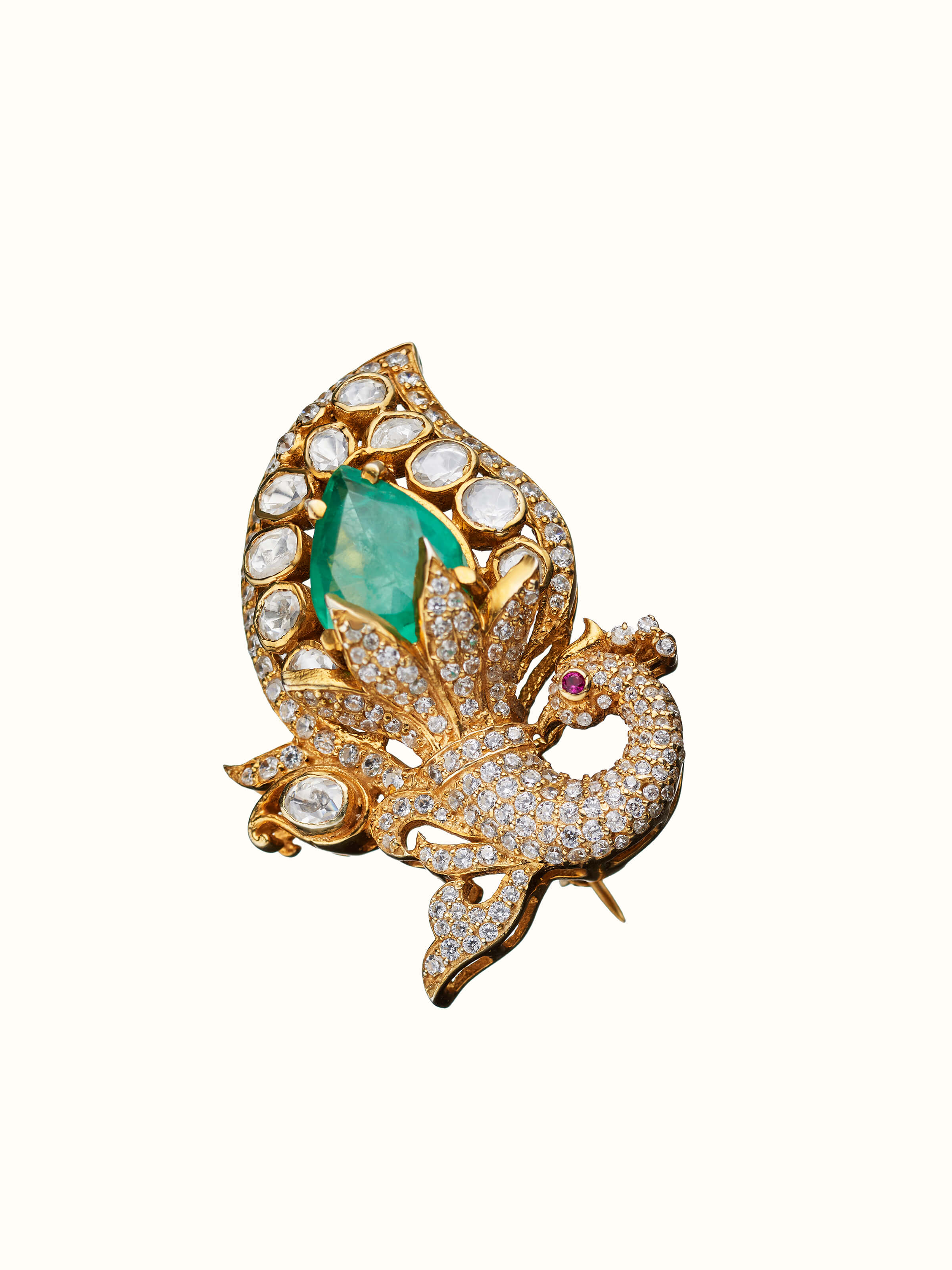 angled view of silver smithing yellow gold brooch pin