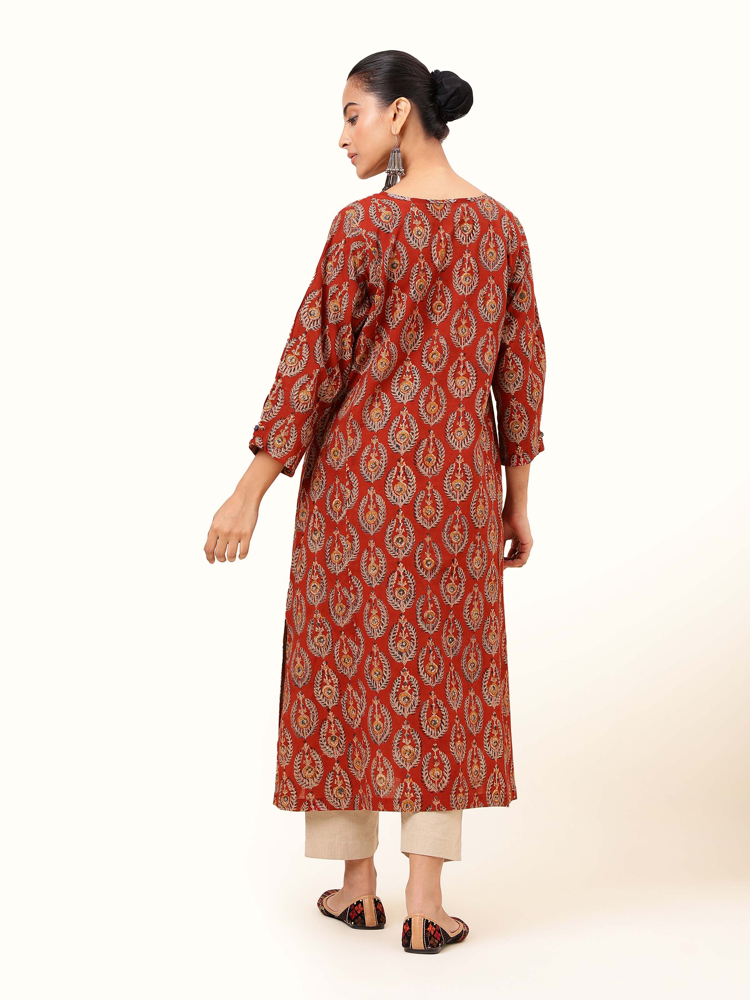 Back view capturing the design continuity and traditional charm.