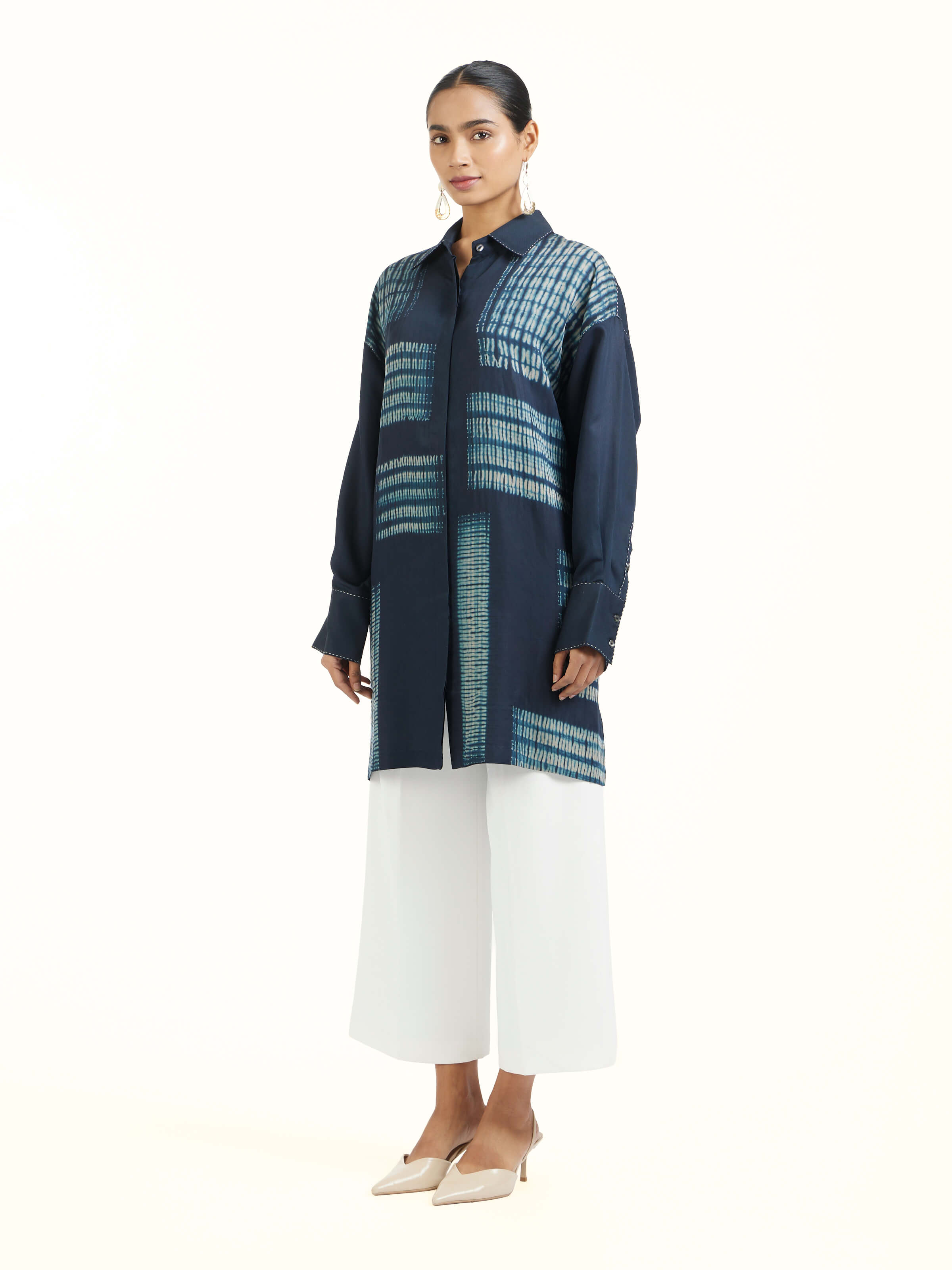 Side view of blue shibori long shirt with straight fit silhouette