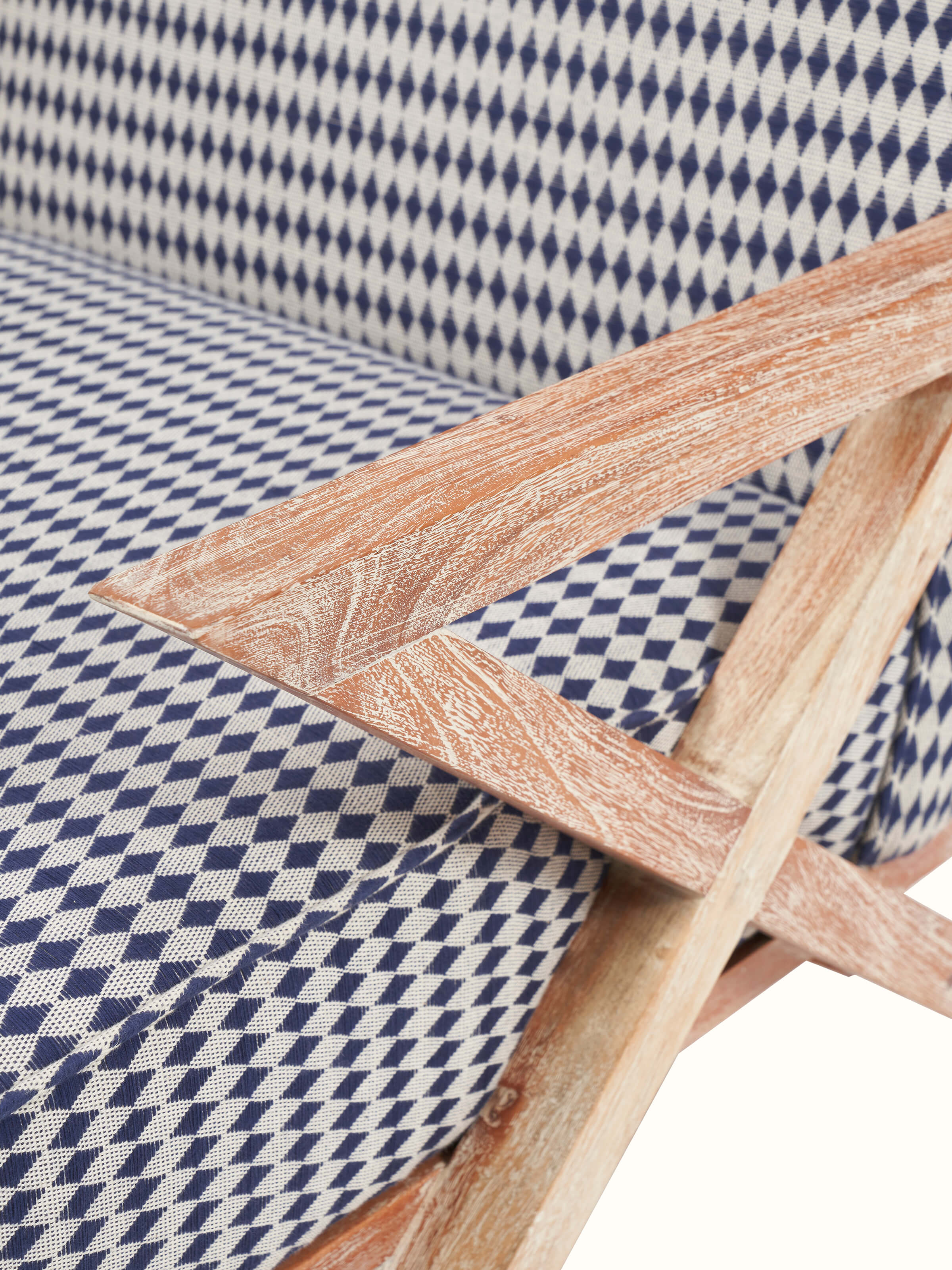 Back view of Swadesh Upholstered Acacia Wood Armchair emphasizing the sturdy wood frame and stylish upholstery