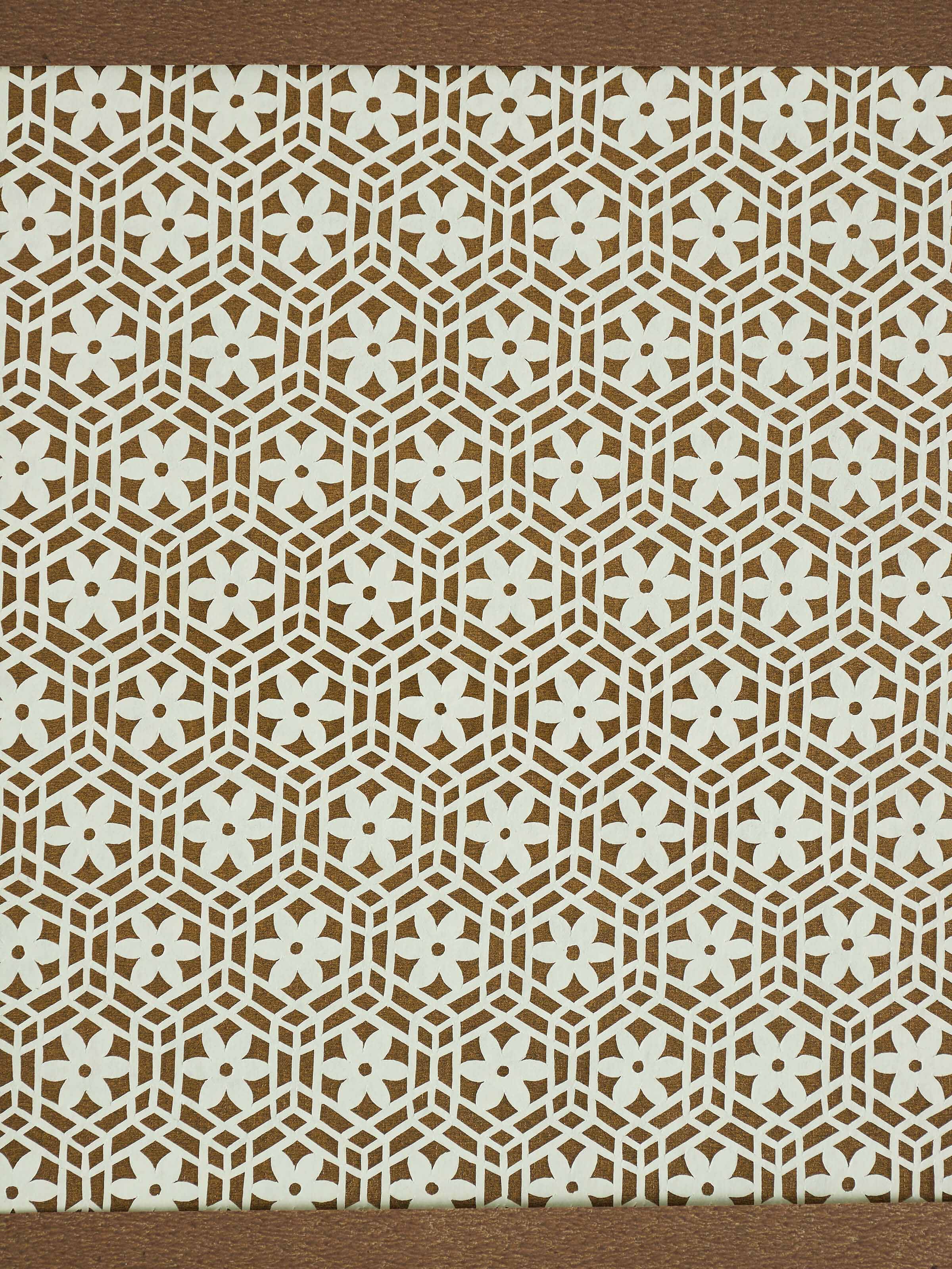 Close-up view of Sanjhi paper stencil flower jaali wall art highlighting the fine paper texture and artistic patterns