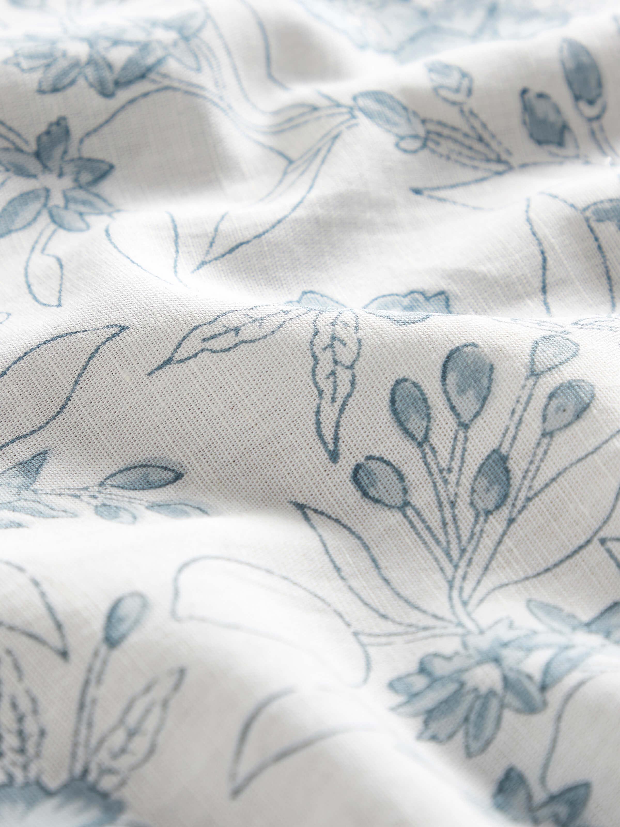 Close-up capturing the fine details and vibrant shades of the floral prints on the fabric