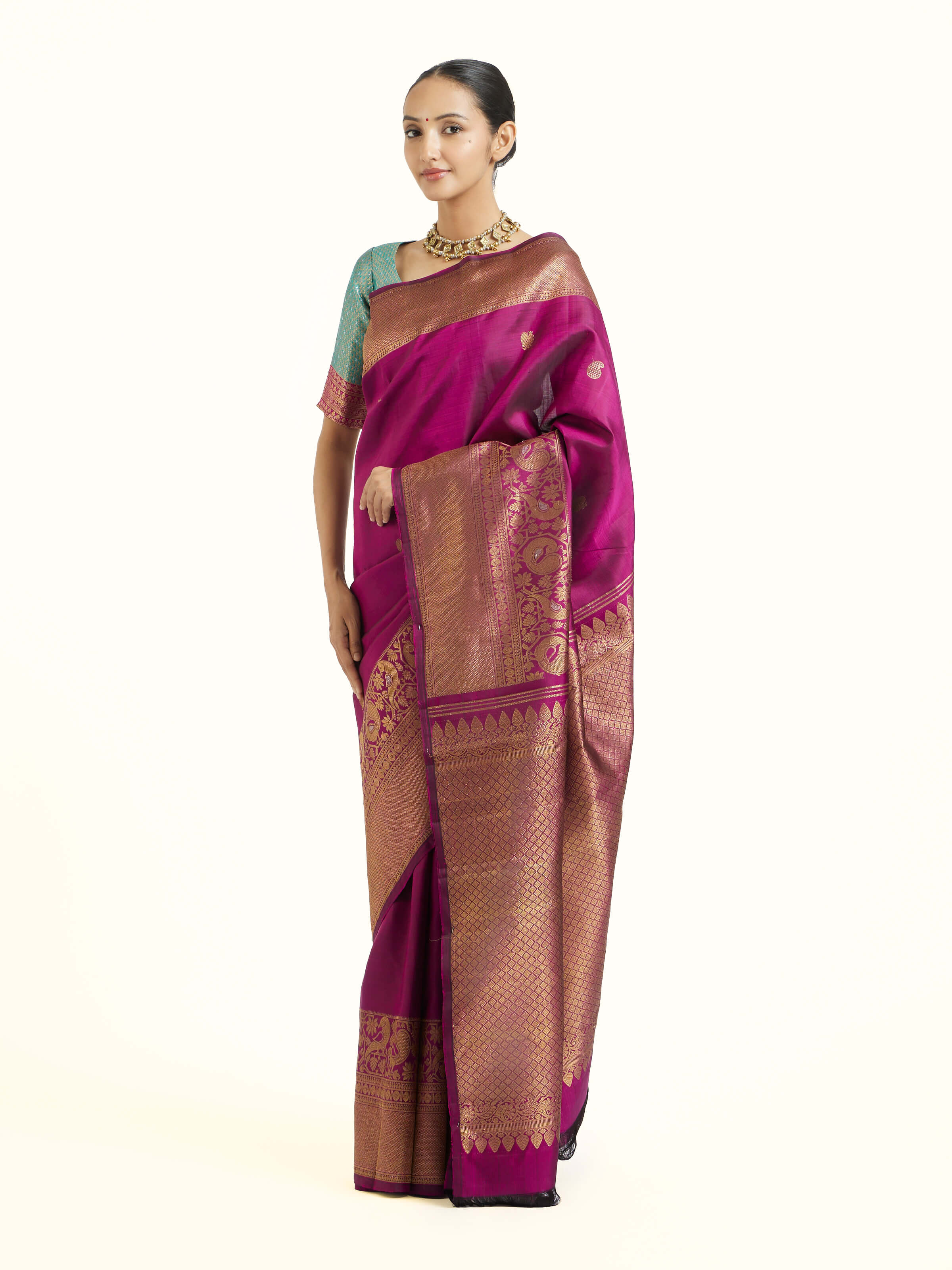 Side view of purple silk Kancheepuram saree showcasing elegant drape
