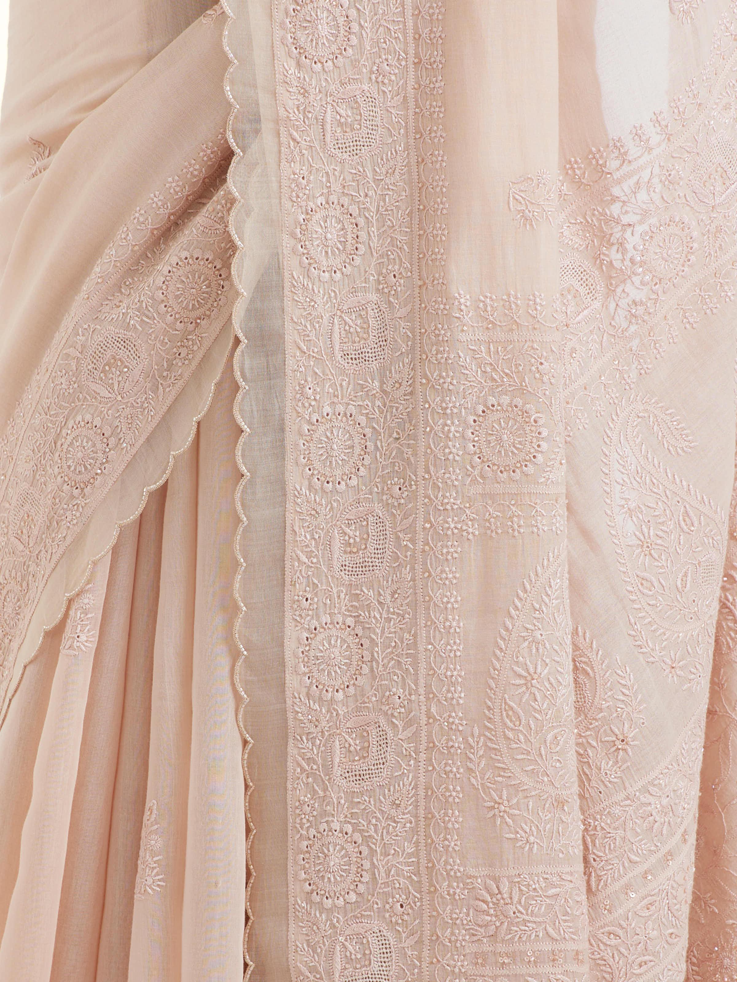 Detail view of pink cotton silk chikankari saree showing fine embroidery and fabric texture