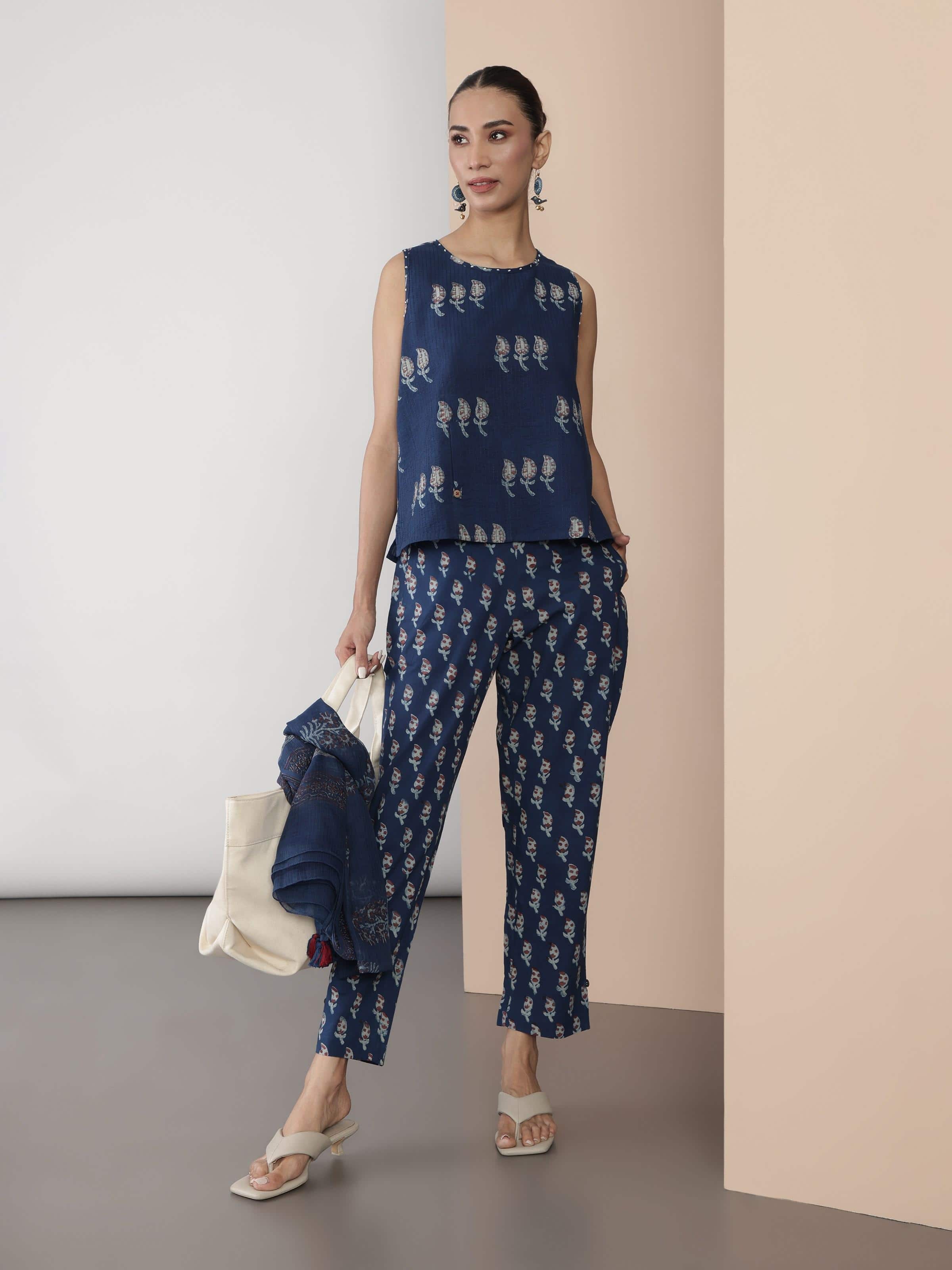 Side pose of model wearing blue Dabu block printed pant showcasing side seam and print alignment.