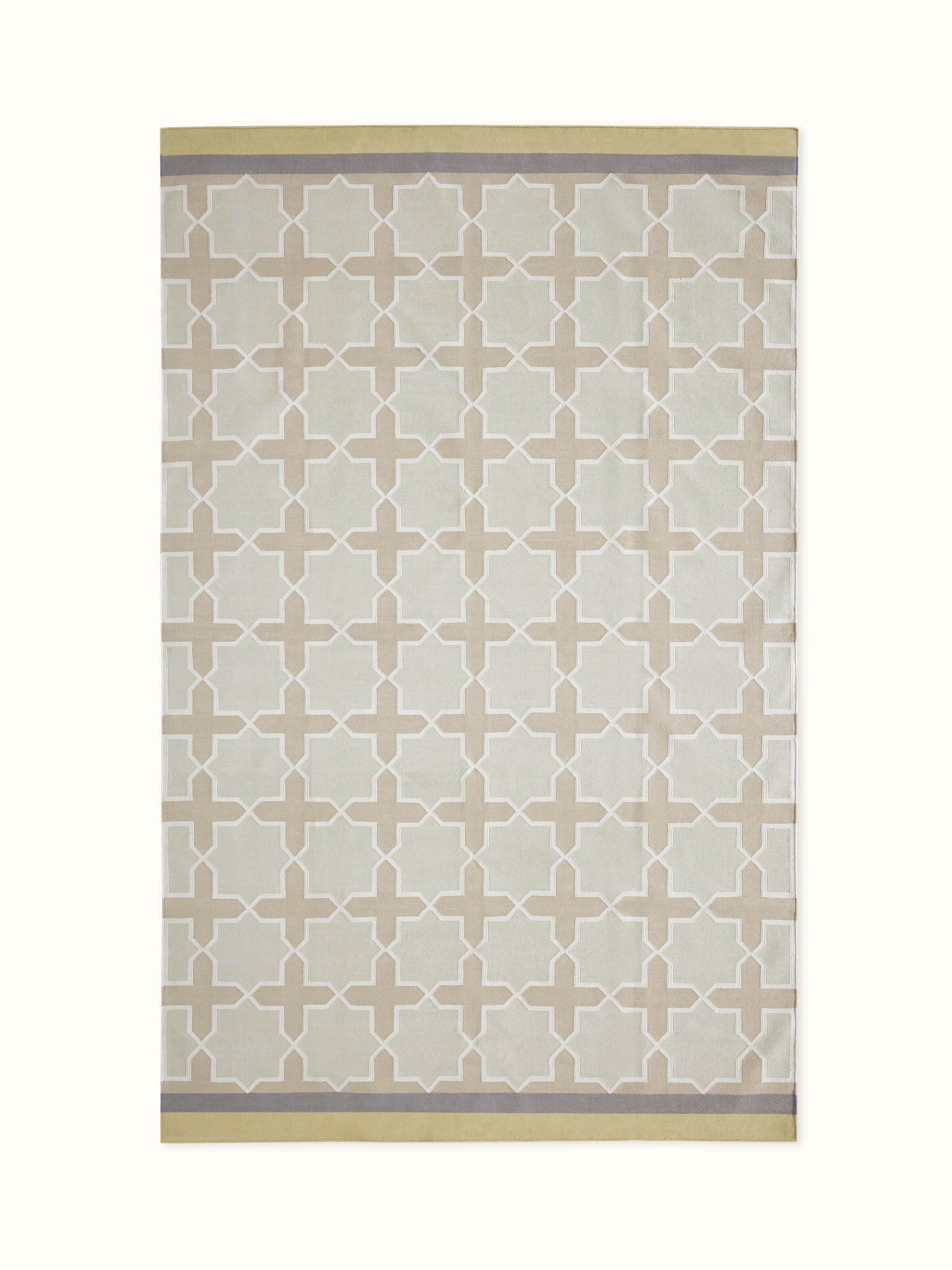 Front view showcasing the modern geometric Jharokha design in beige and green on the cotton Panja dhurrie