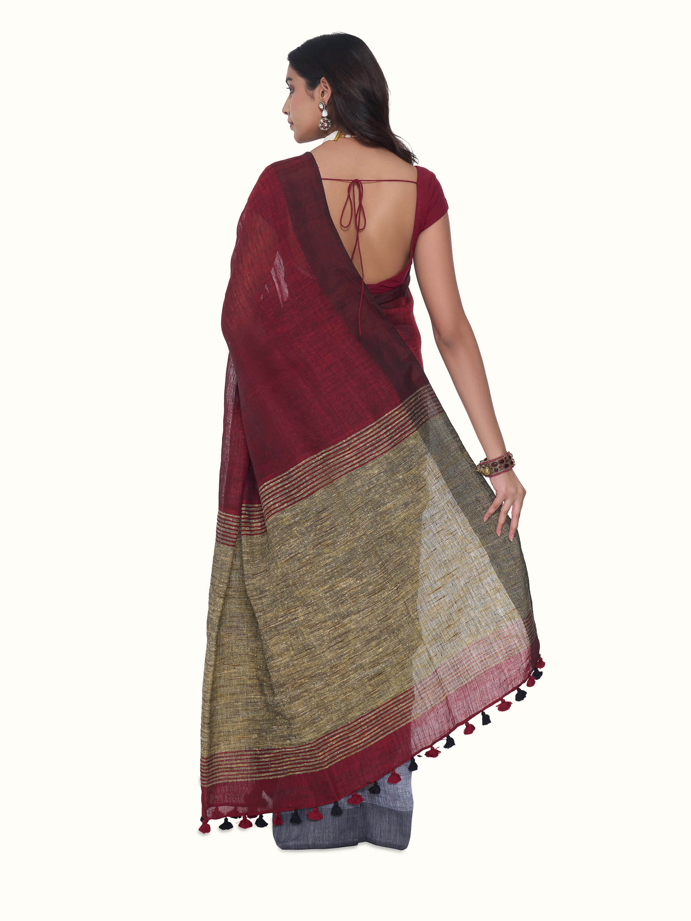 Back view of grey linen saree displaying full pallu and overall pattern