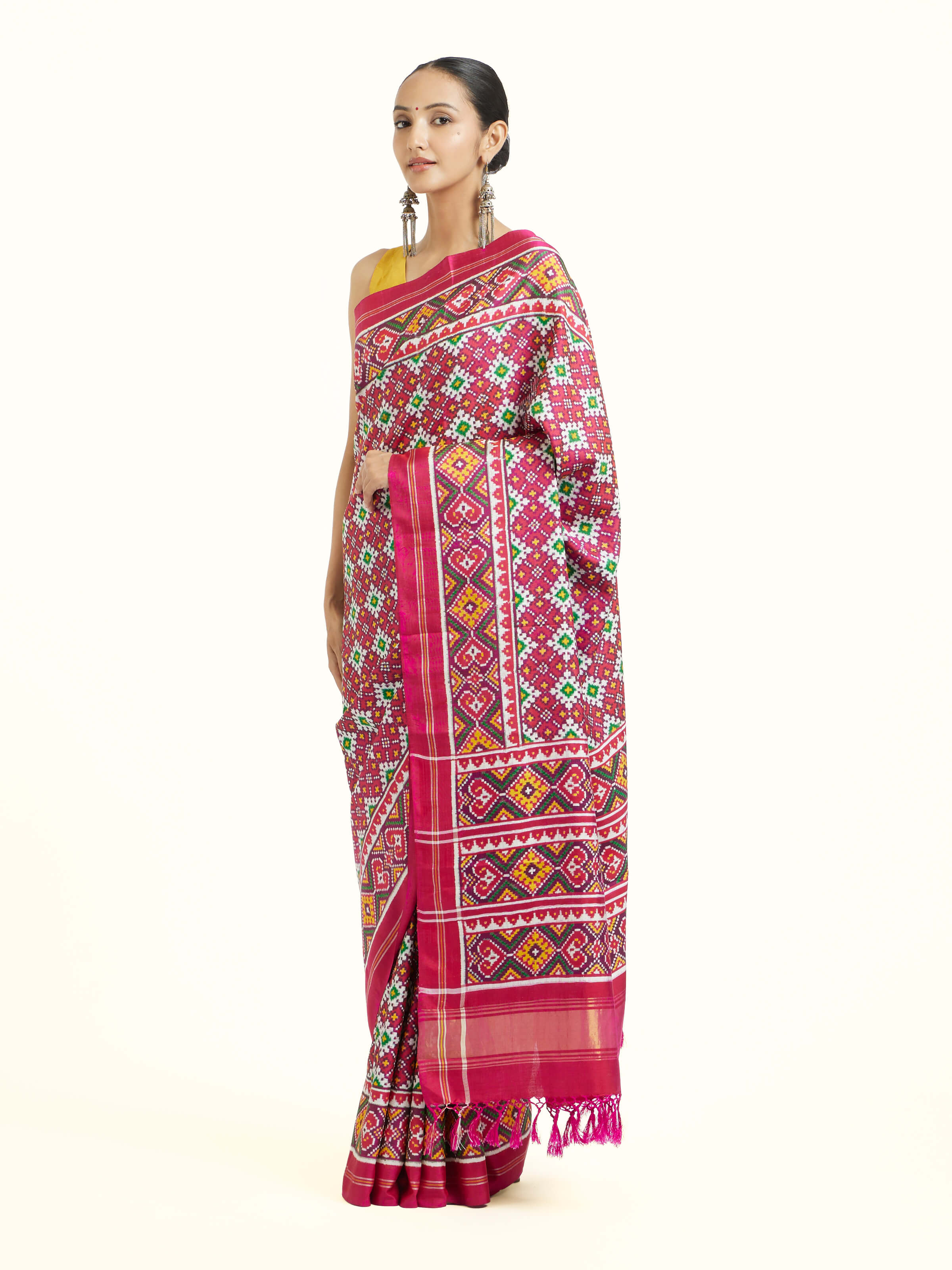 Side view of pink mulberry silk Patan Patola saree with elegant drape