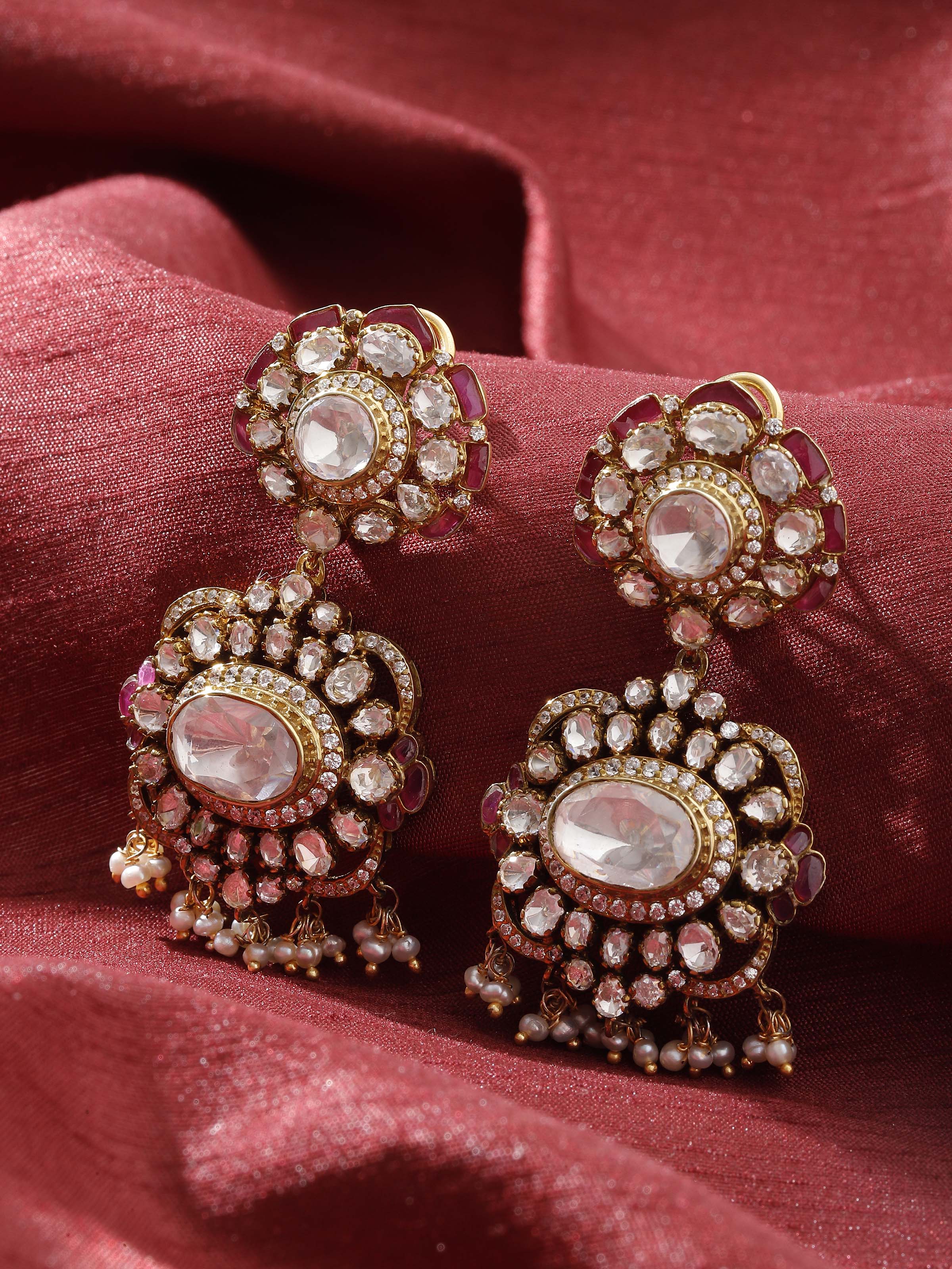 Lifestyle view of silver smithing drop earrings