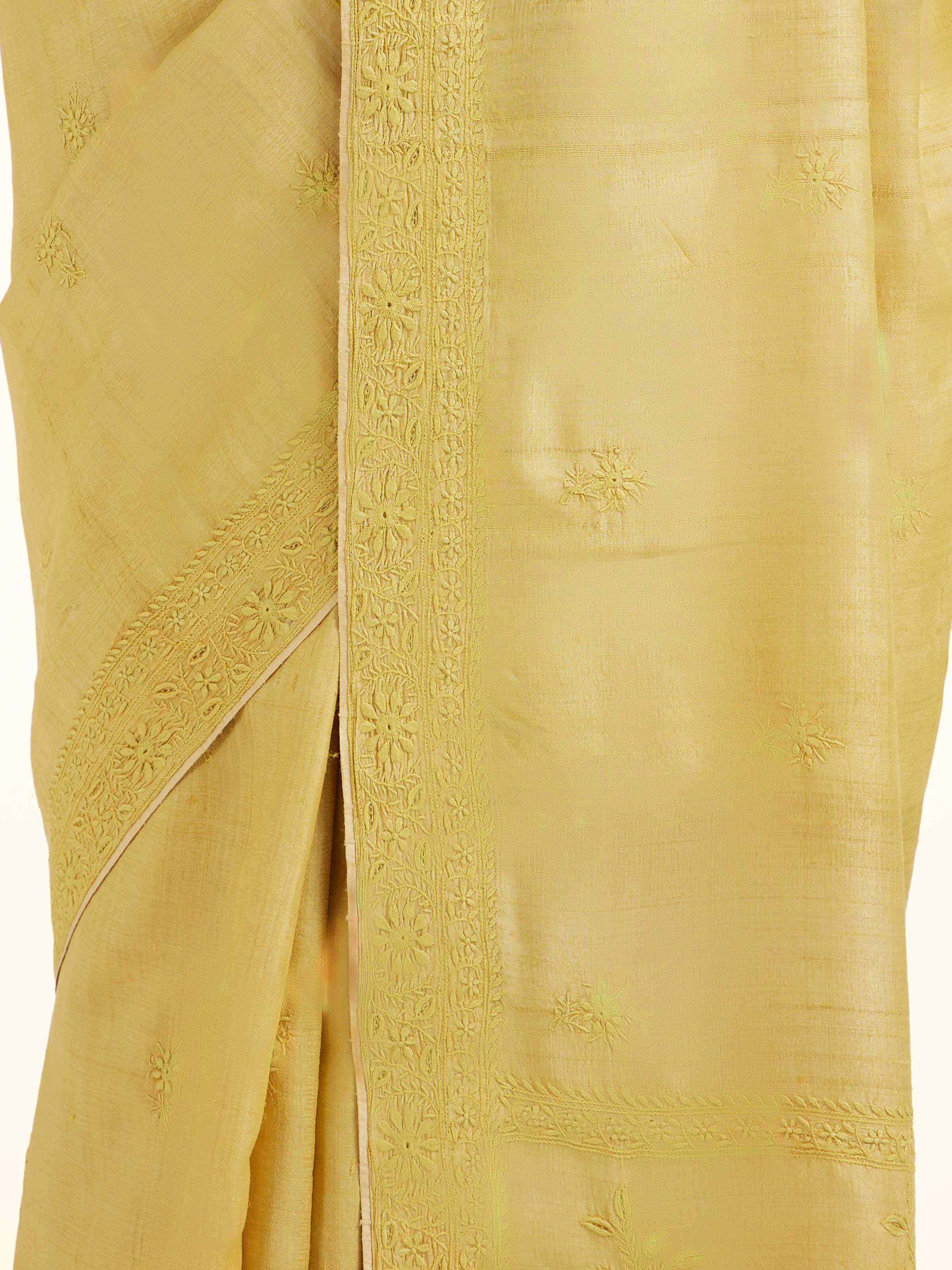 Detail view of yellow silk Chikankari saree showing silk texture and embroidery finesse