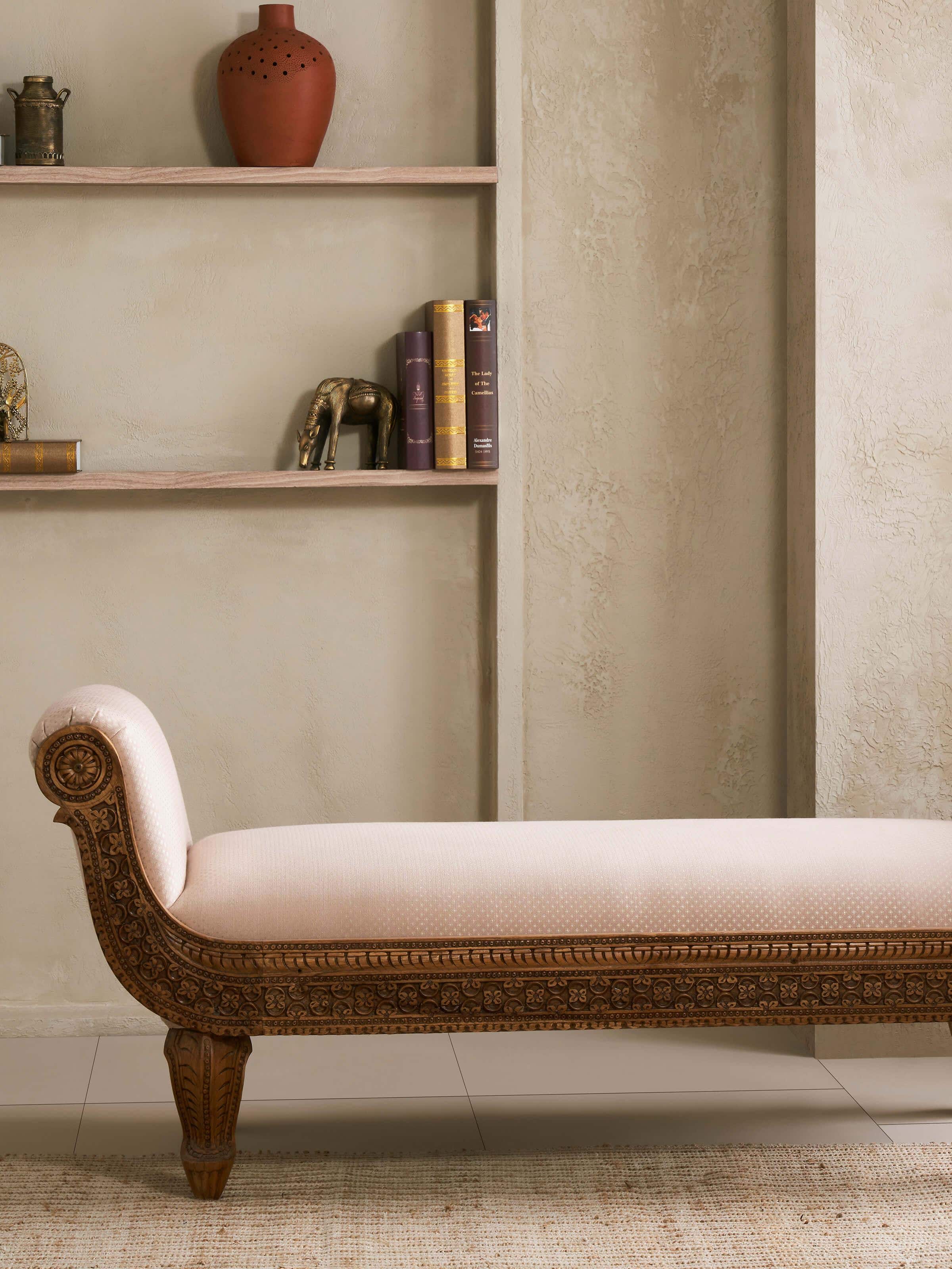 Side view of Carved Sheesham Wood Upholstered Bench showcasing the beautifully carved wood and soft upholstery for comfort.