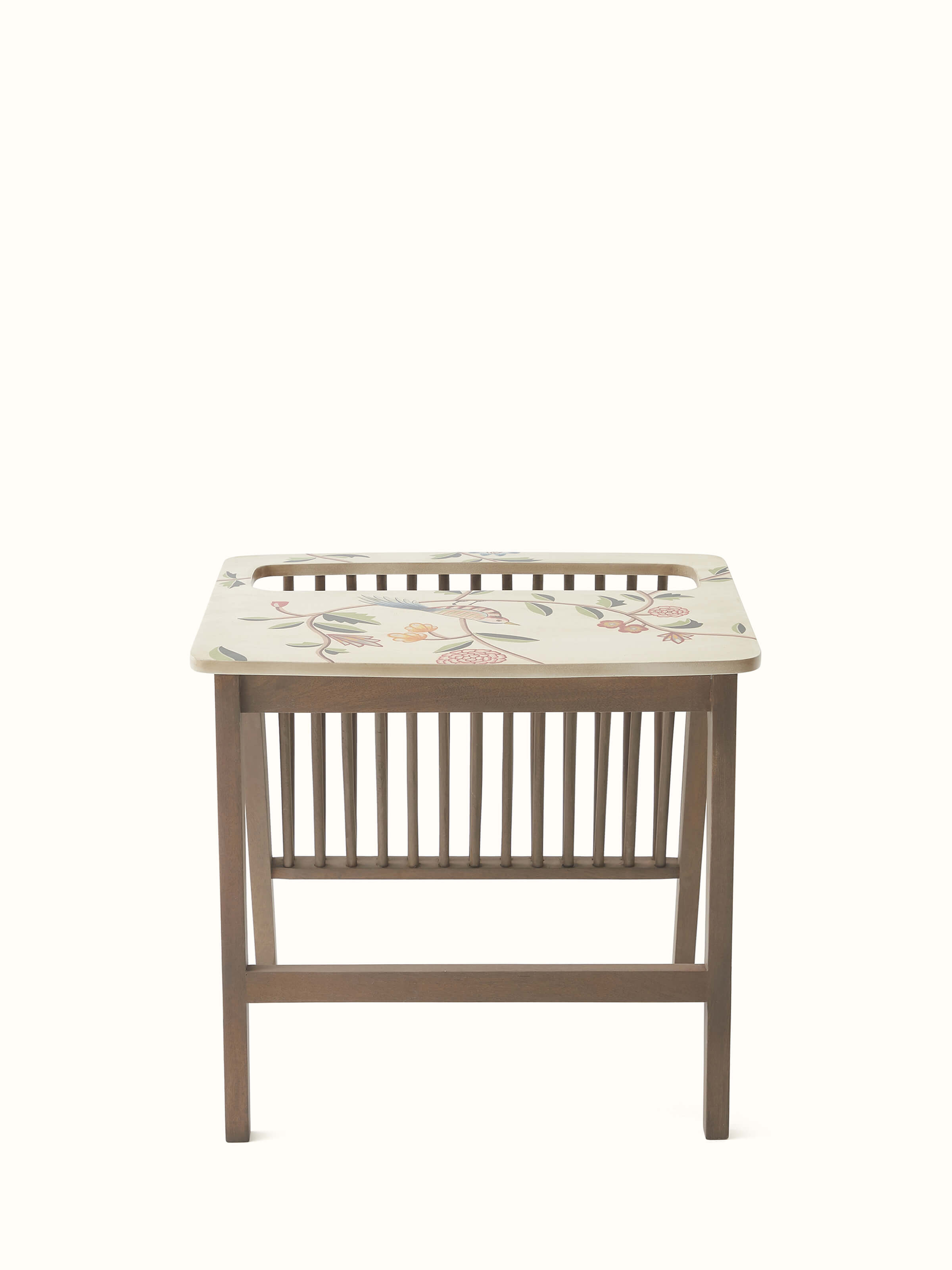 Detailed view of the miniature painting on the mango wood magazine rack, highlighting the artistic elements and vibrant colors.