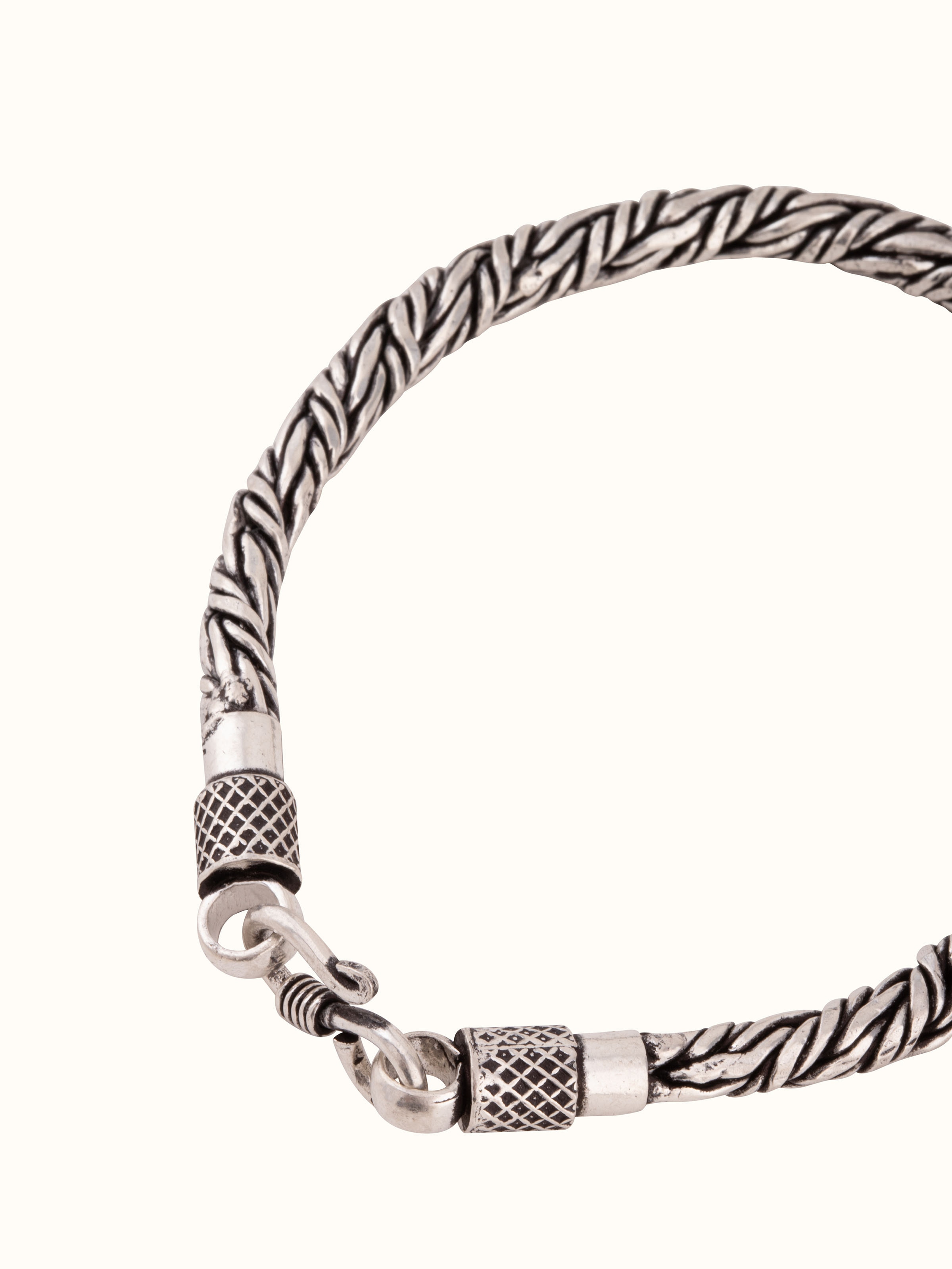 Overhead view of silver flexi bracelet laid flat, revealing full length and uniform design.