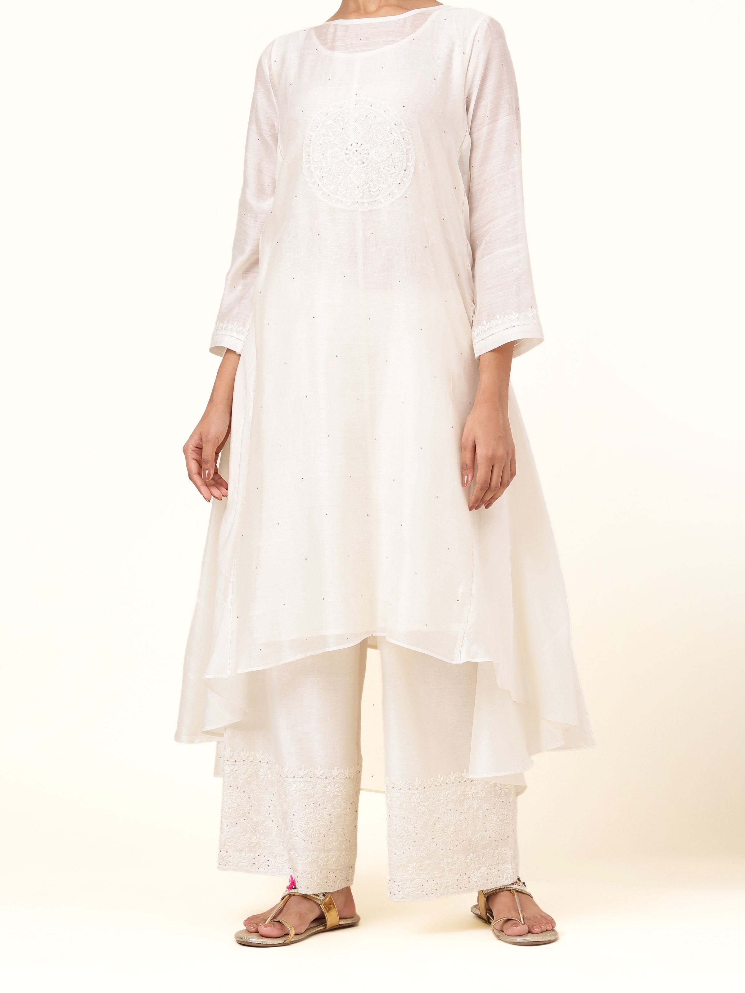 Front view of off-white cotton silk Chikankari palazzo showcasing elegant embroidery and relaxed silhouette