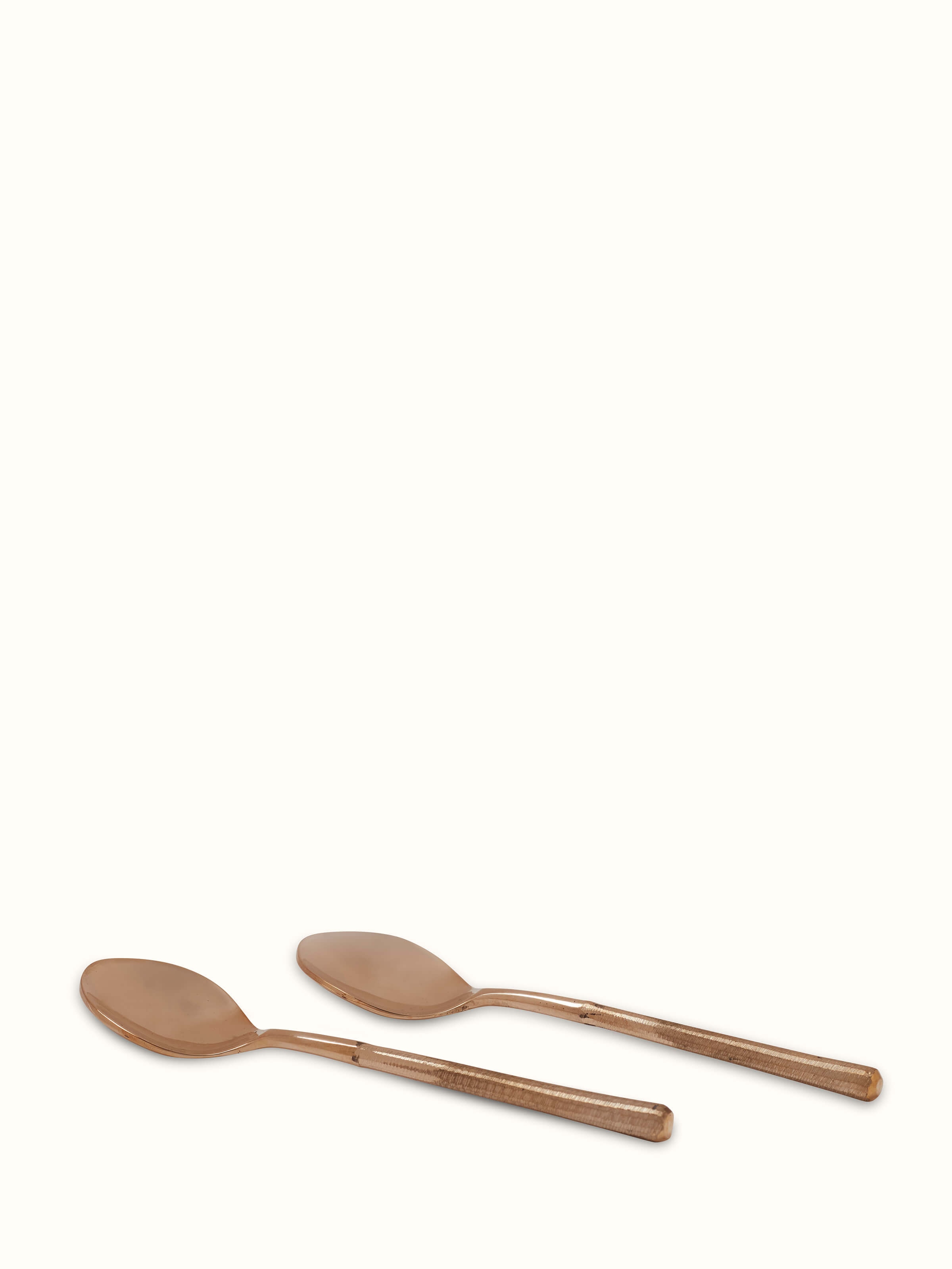 Front view of Bell metal teaspoon featuring a polished finish and classic design