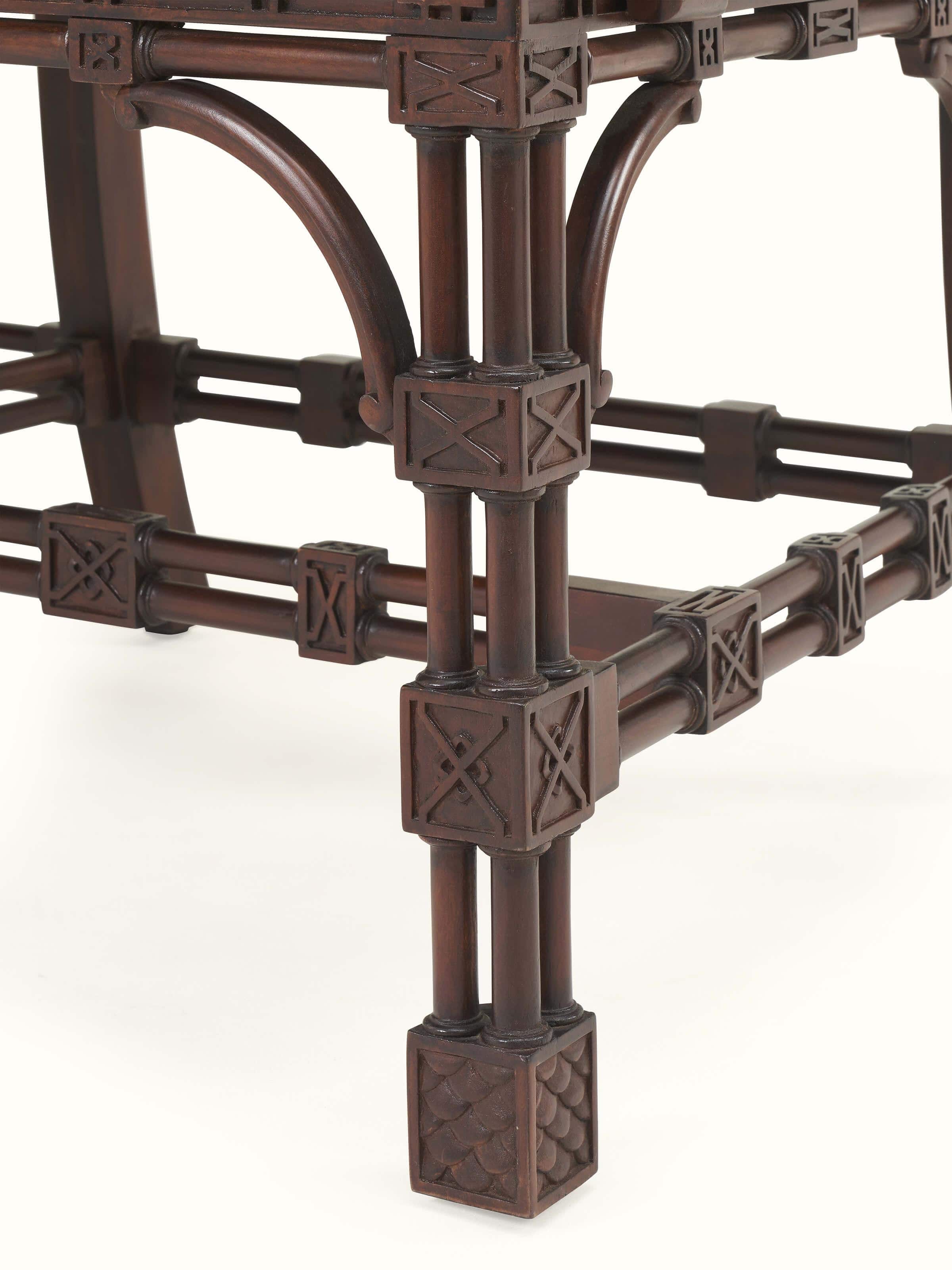 Close-up detail view of arm and cushion design on upholstered mahogany wood 3-seater sofa